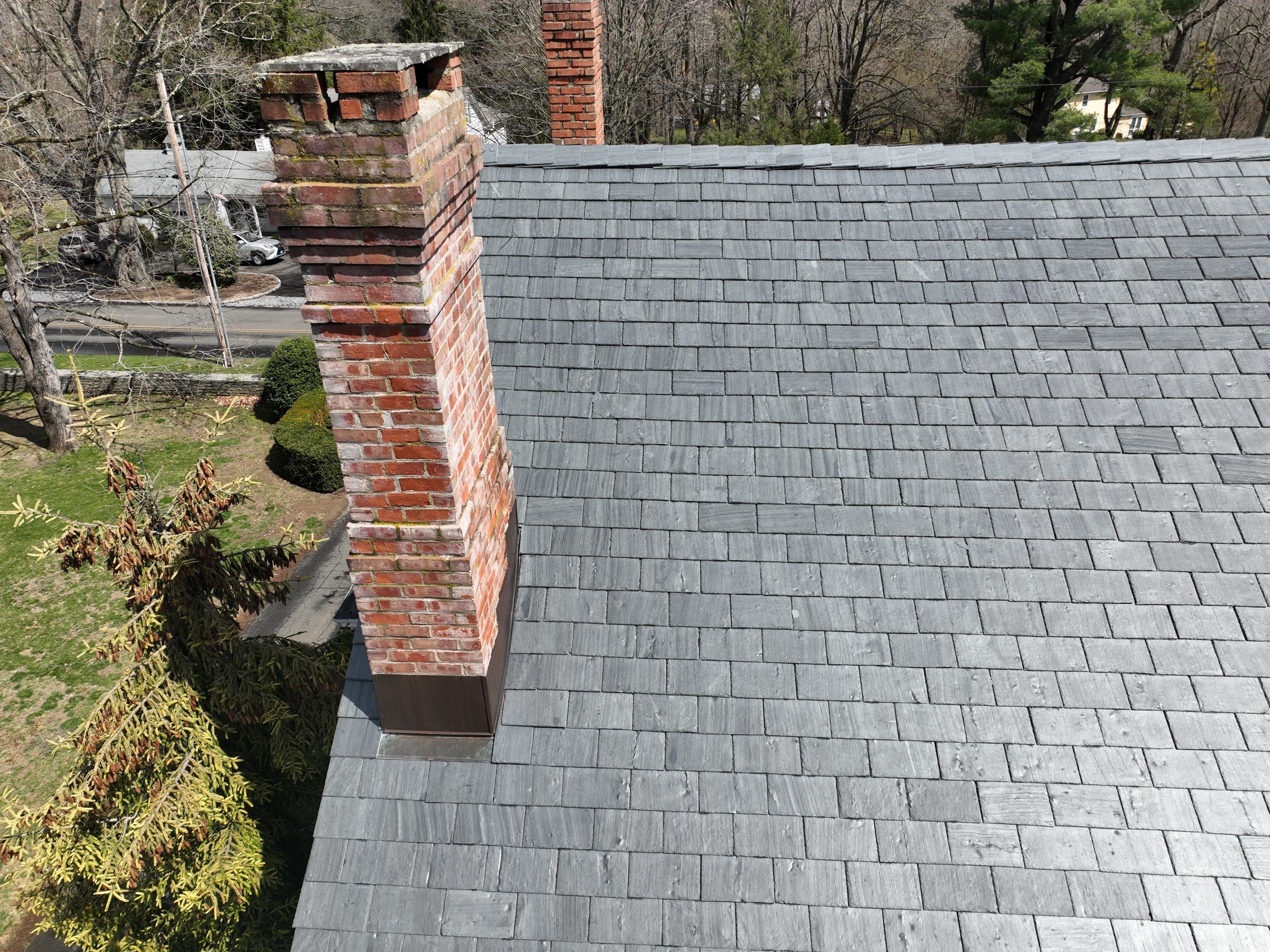 Residential Roofing Installation using Vermont Slate by A Plus Exterior
