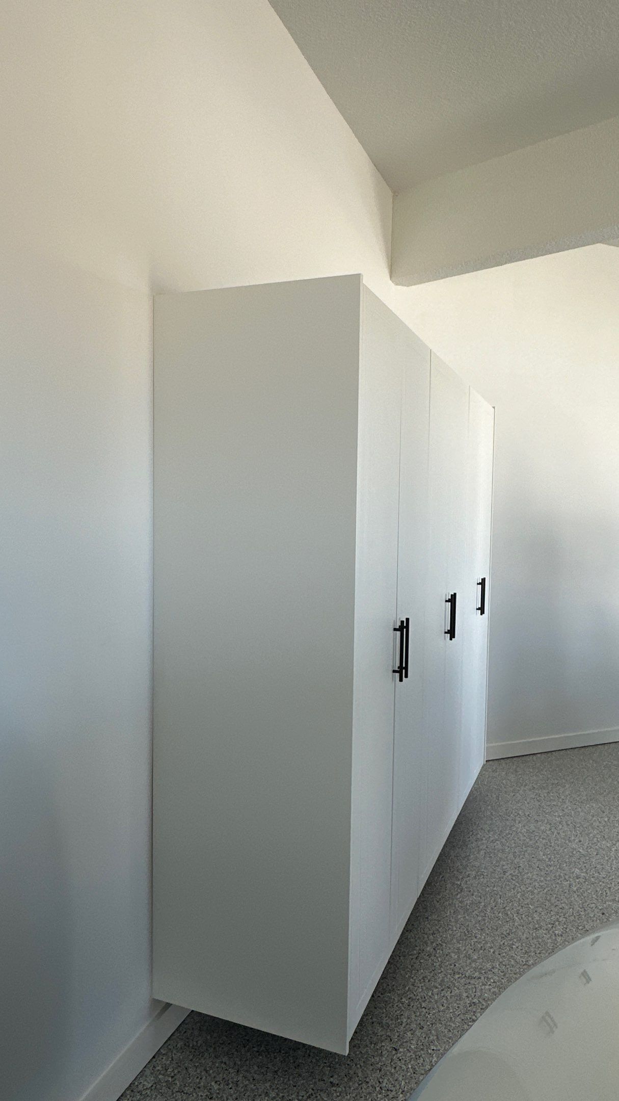 Jon S. transformed his garage with a new floor, slotwall & Cabinets! by Banner Garage