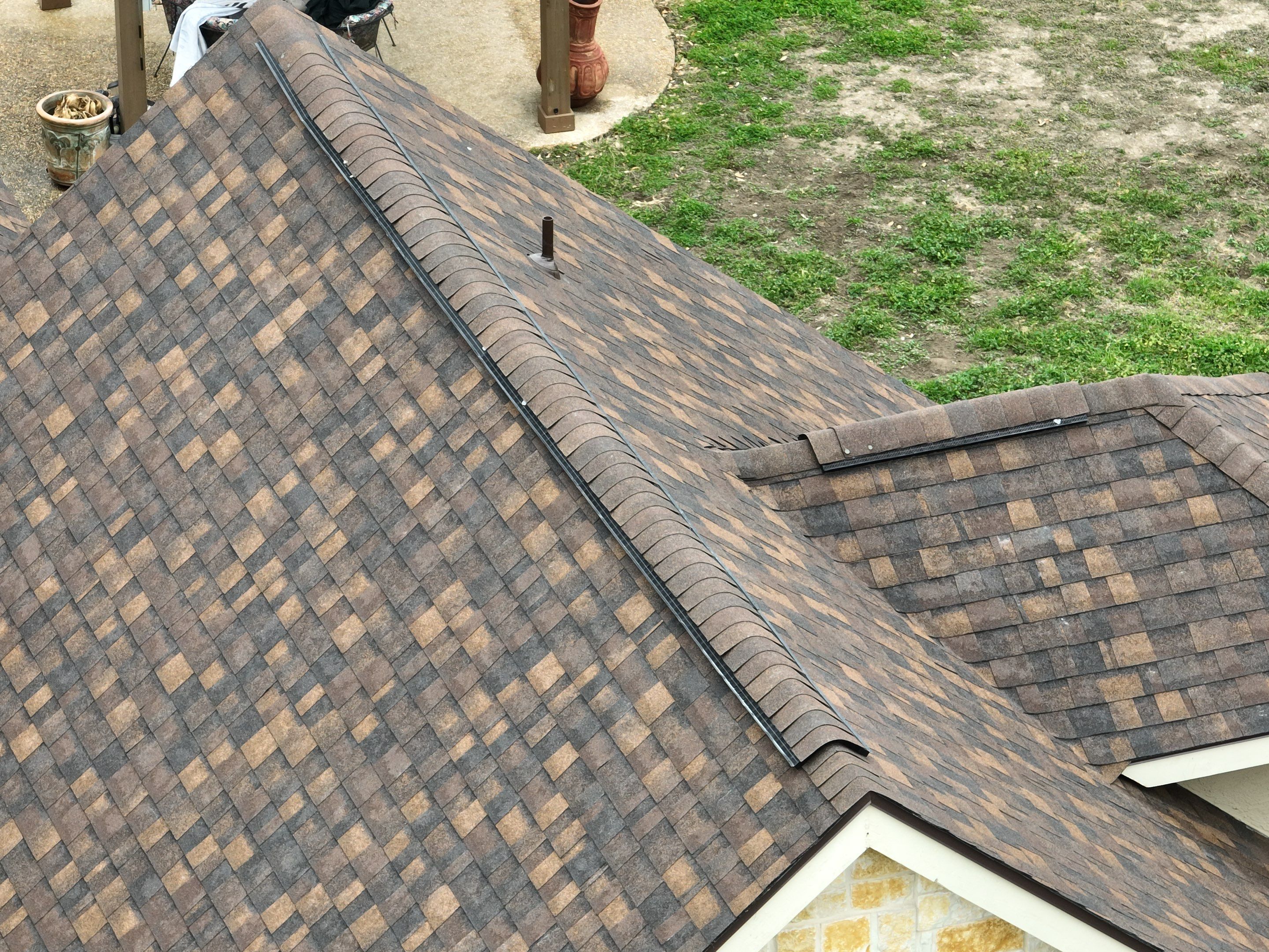 Residential Roof Replacement using 30 Year Laminate Shingles with High Profile Ridge by Premier Roofing and Contracting