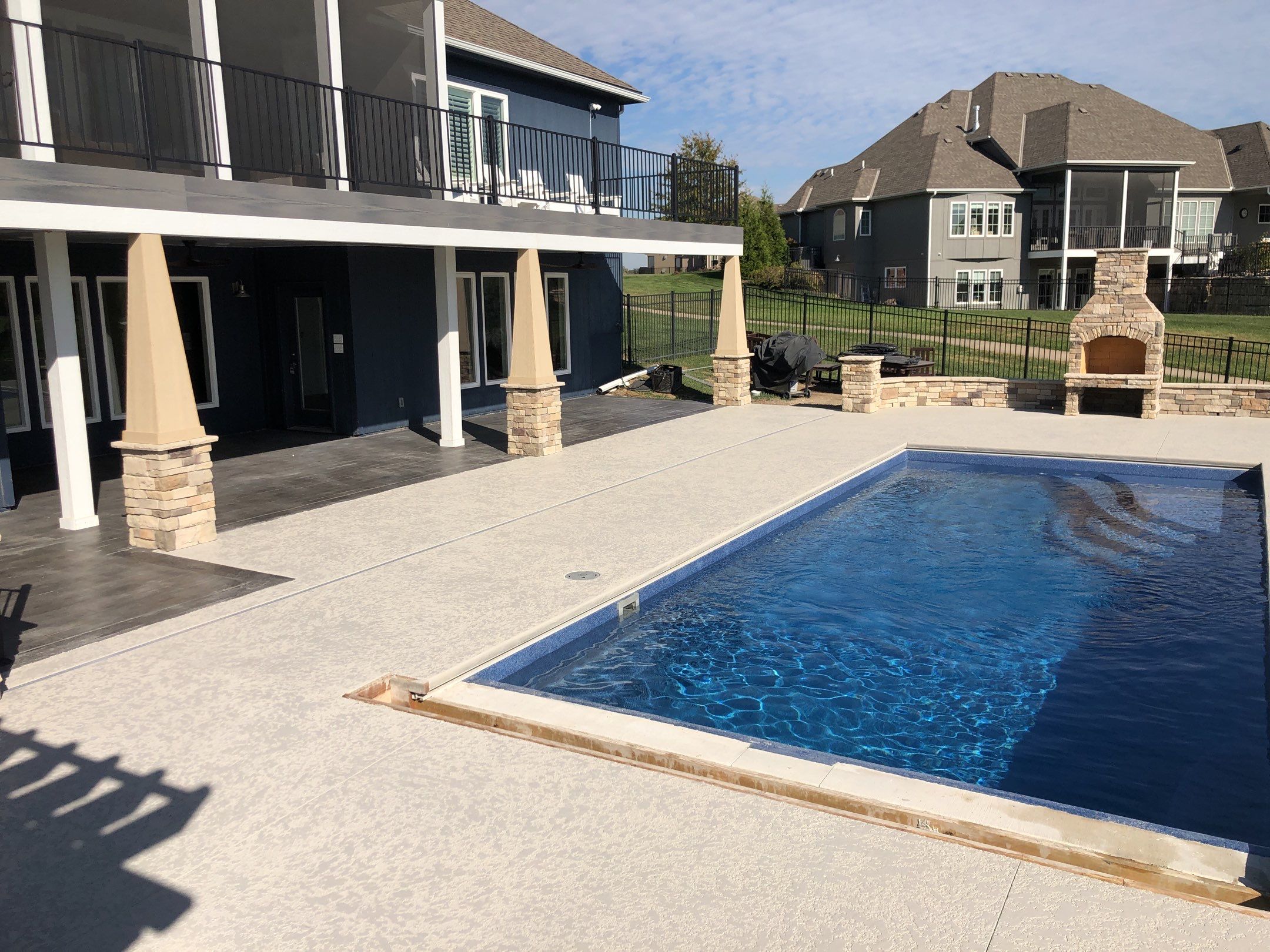 Parkville, MO -- Pool Deck Coating with Classic Texture (knockdown) finish by Big Red Decorative Concrete, LLC