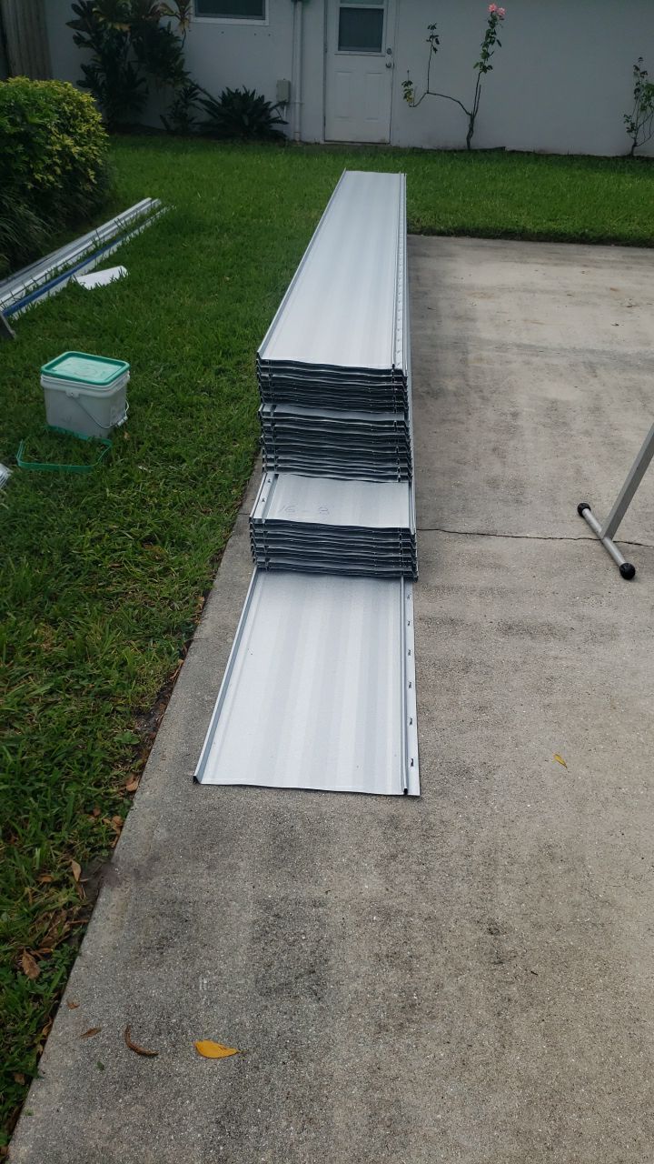 Residential Roofing Installation using 1" Nail strip metal roof by BLUES BROTHERS CONSTRUCTION CORP