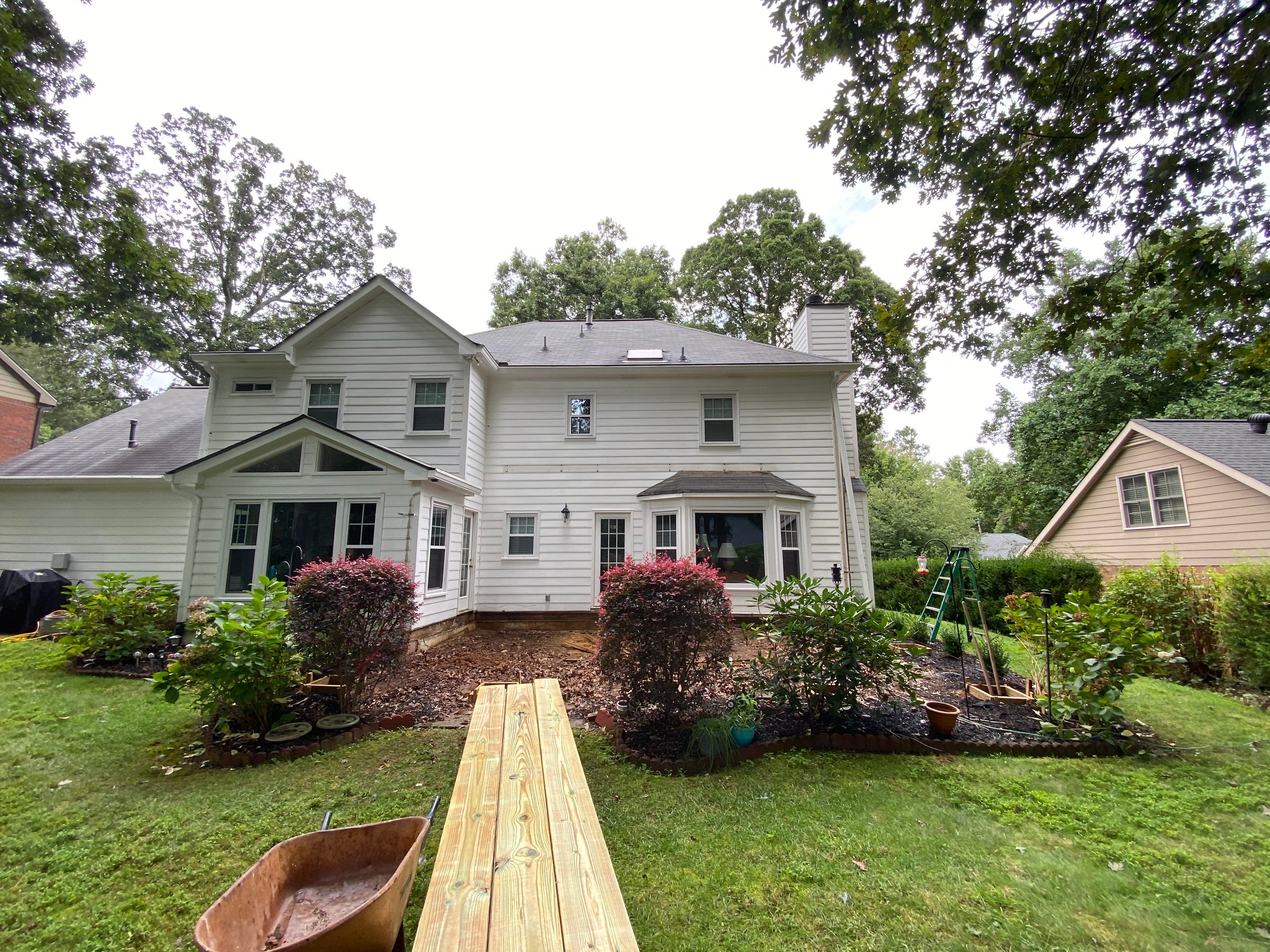 Custom Screened Porch with Beadboard Ceiling and Composite Decking by Swift Home Renovations