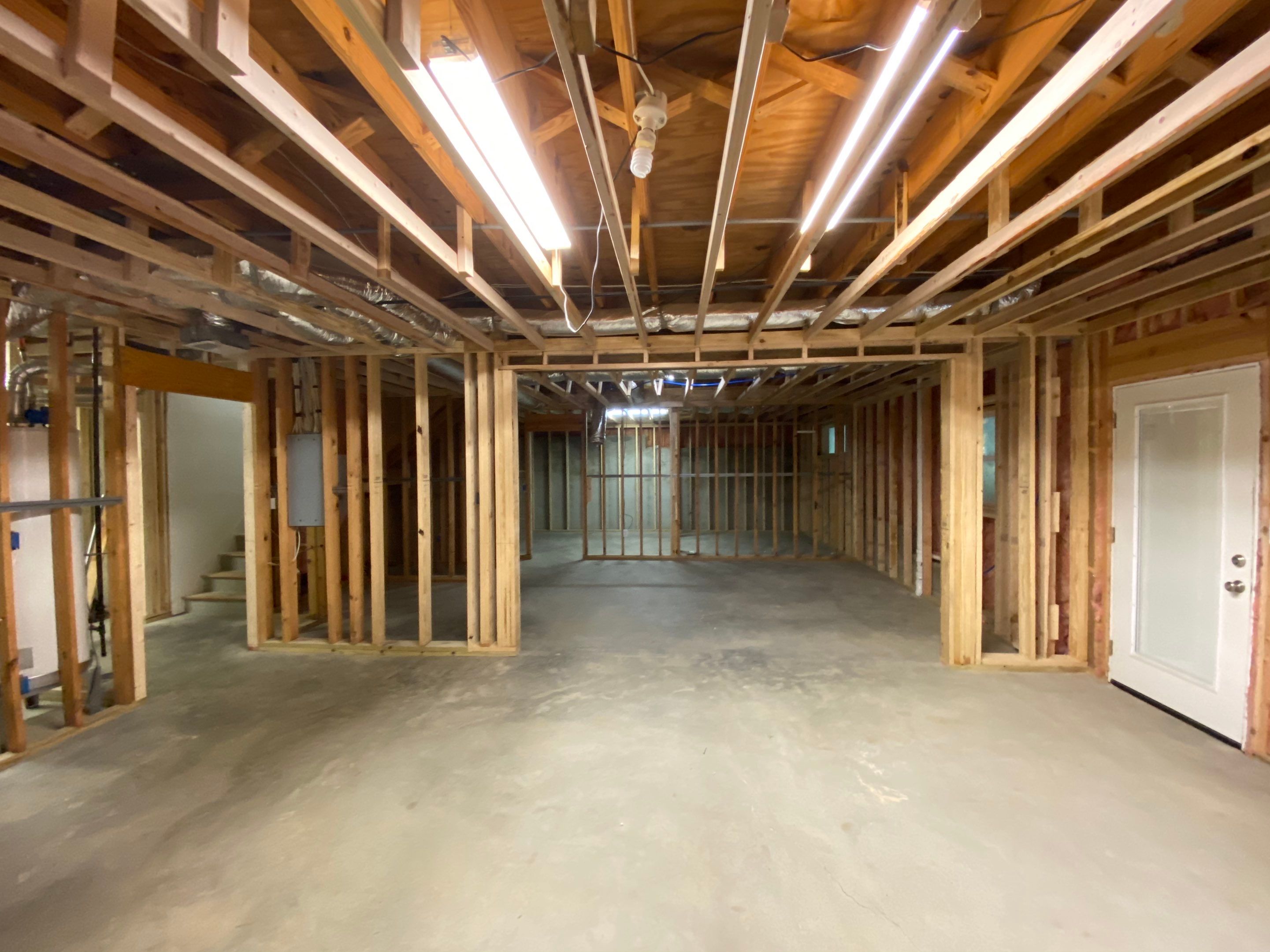 Acworth Basement Transformation With Wet Bar and Stone Fireplace by Swift Home Renovations