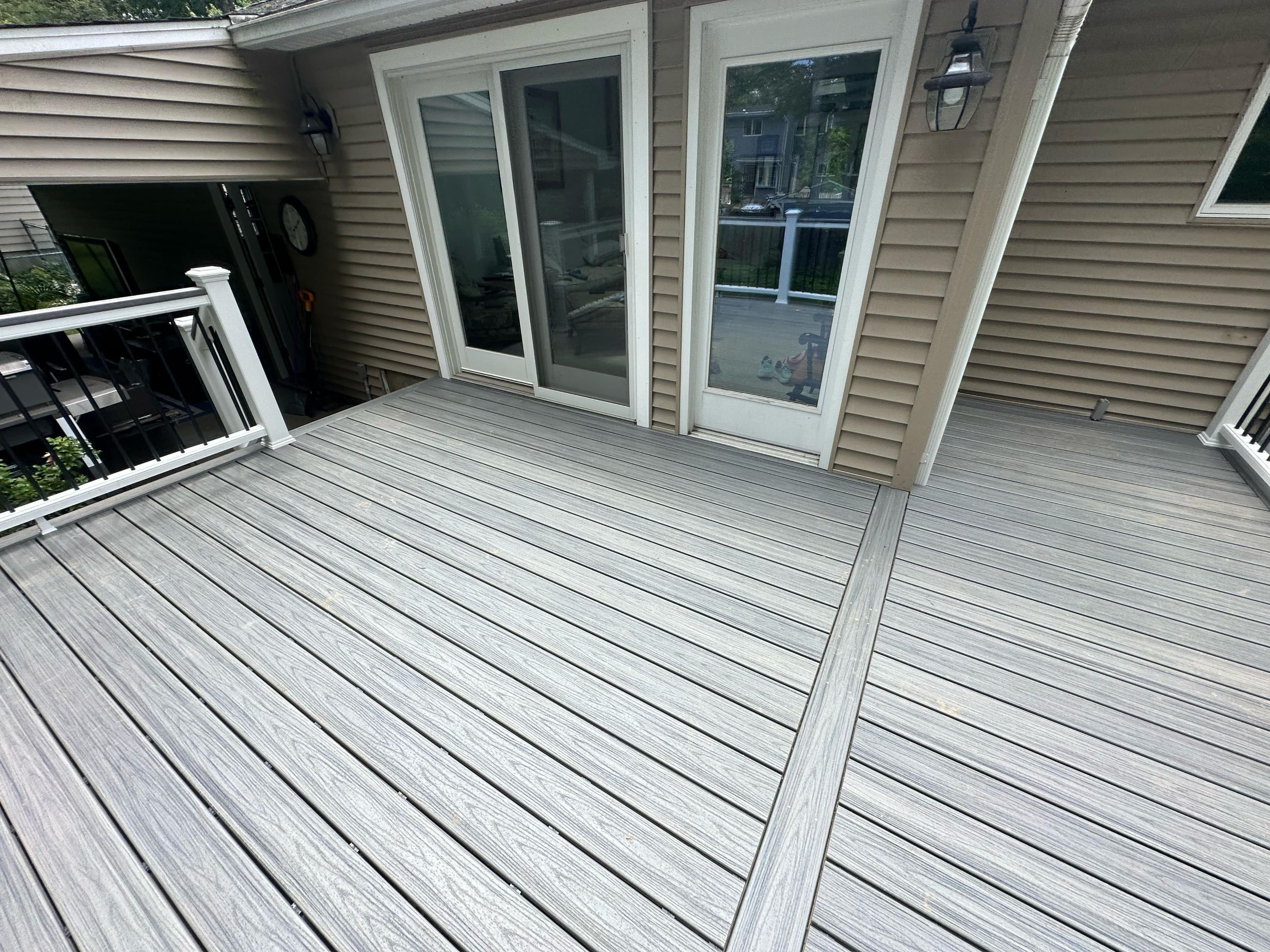 Deck Replacement with Trex Tropical Island Mist , matching cocktail rail and lattice bottom by DiGiorgi Roofing and Siding Inc