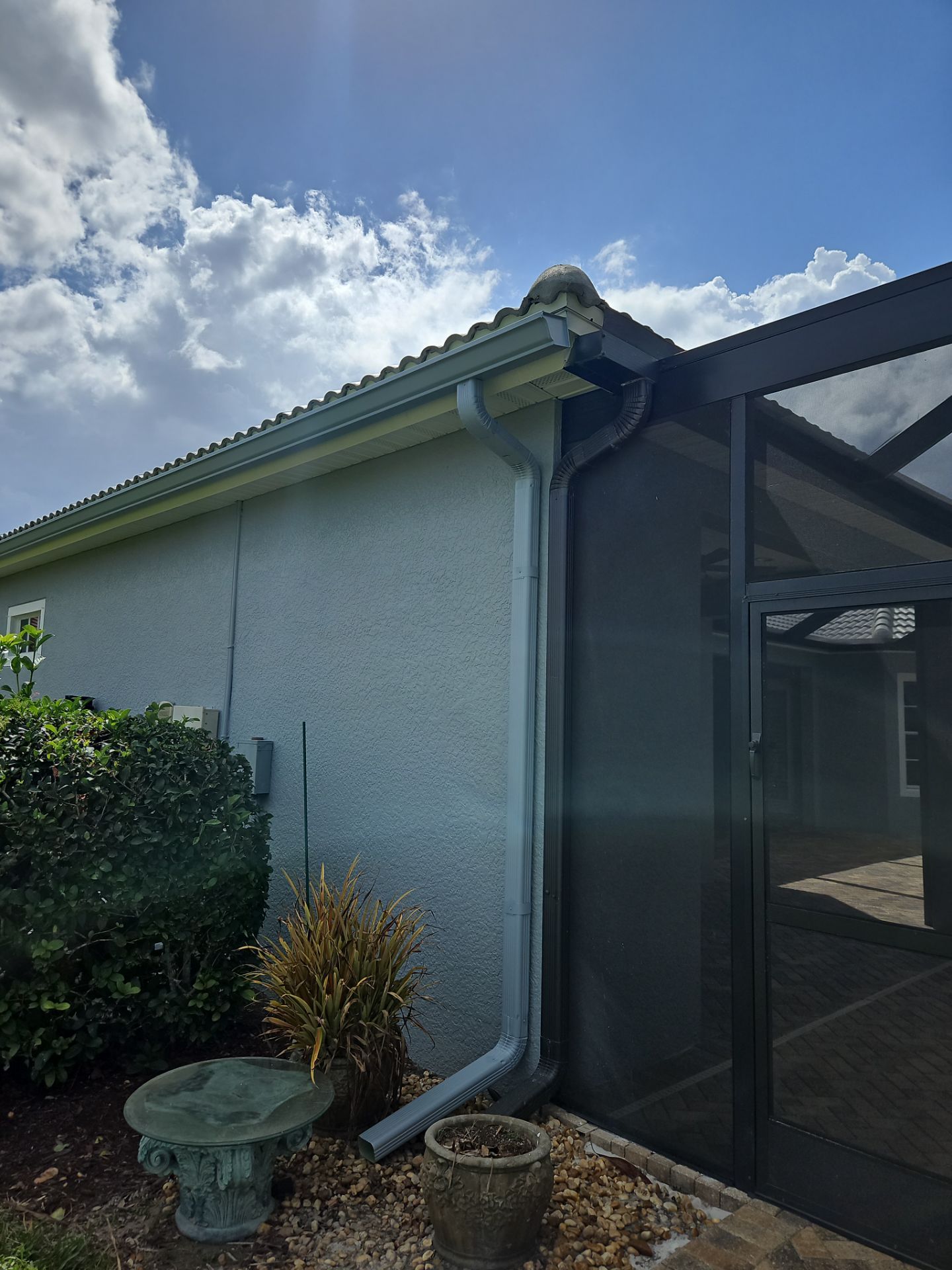 6-inch K-style Seamless Gutters and Splash Guard in Grey Color in Naples FL by Gutter Professors