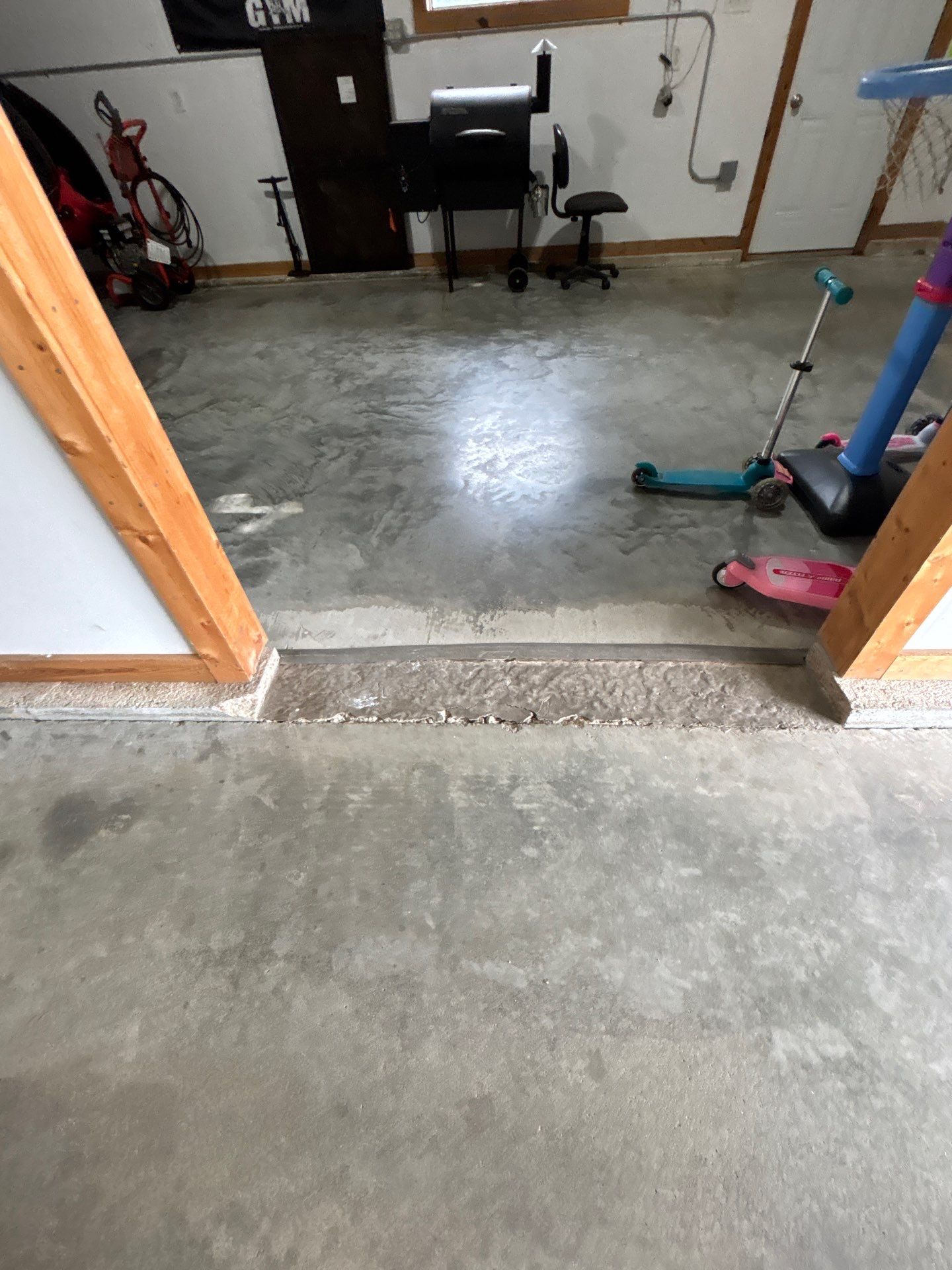 Gray and Black Speckled Polyurea Garage Floor in Dell Rapids by Select Painting, Coatings & Garage Cabinets