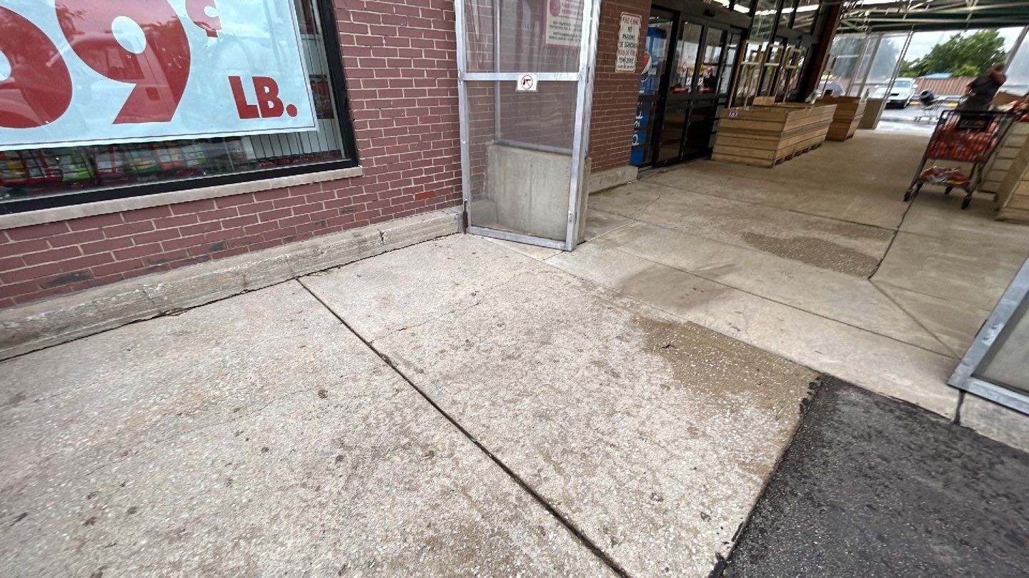 Concrete sidewalk cleaning and degreasing by Northern Power Washing LLC.