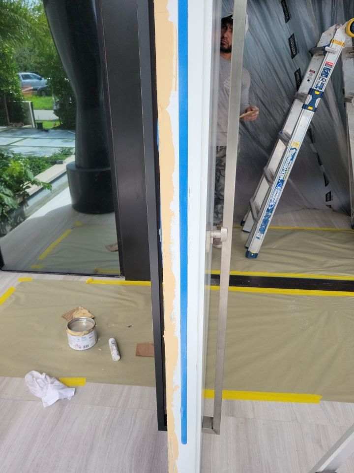 Custom Material Pivot Door installation by Impact Precious Wood Inc.