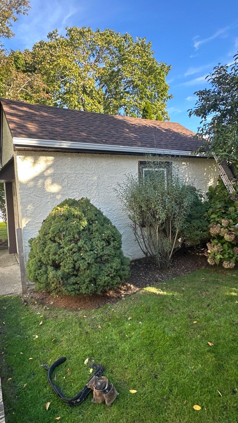 White Seamless Gutter Installation for West Hempstead Stucco Home by Above All Gutters