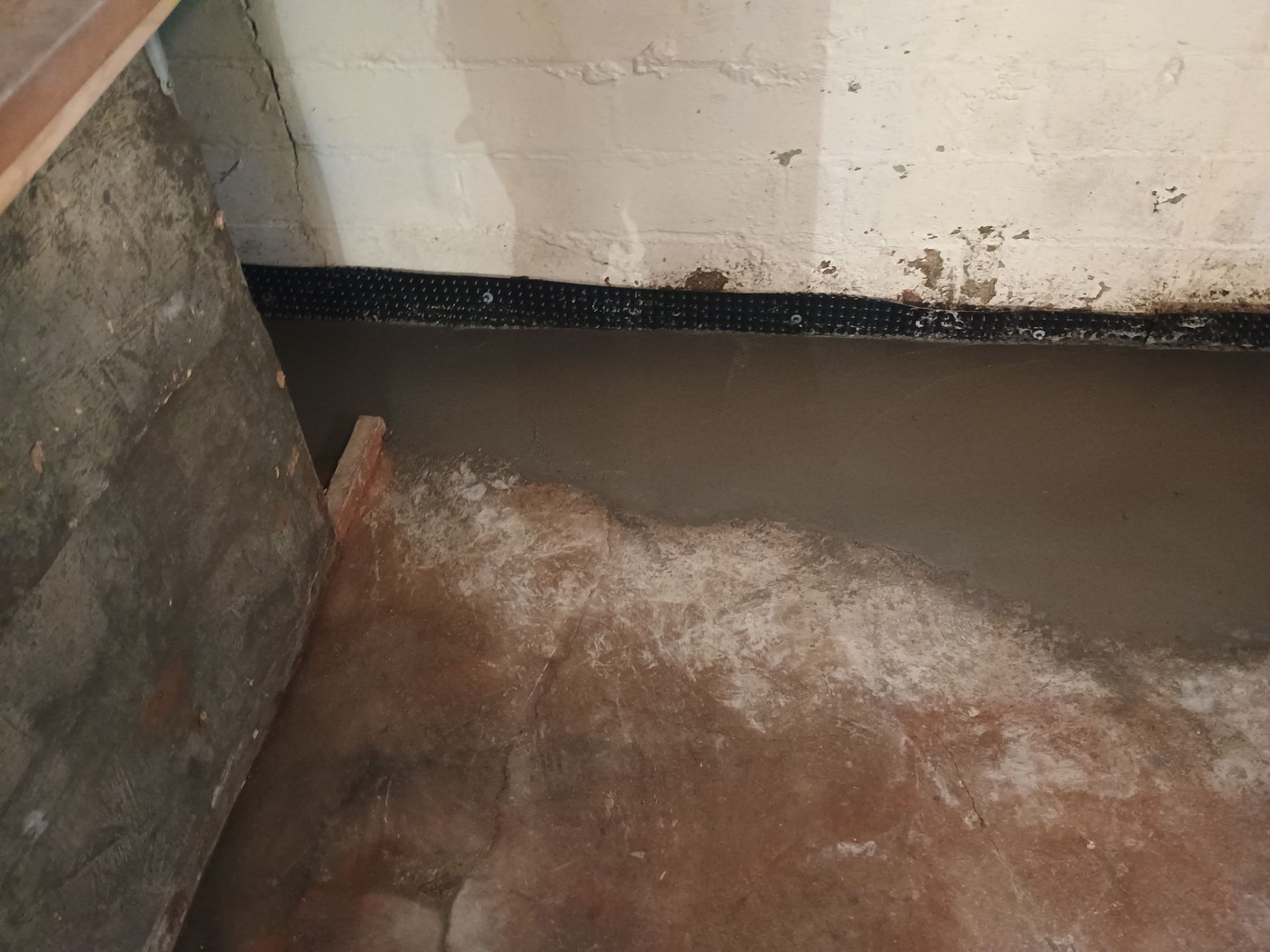 Interior Drain Tile & Sump Pump System in North Minneapolis by Waterproofing Northeast