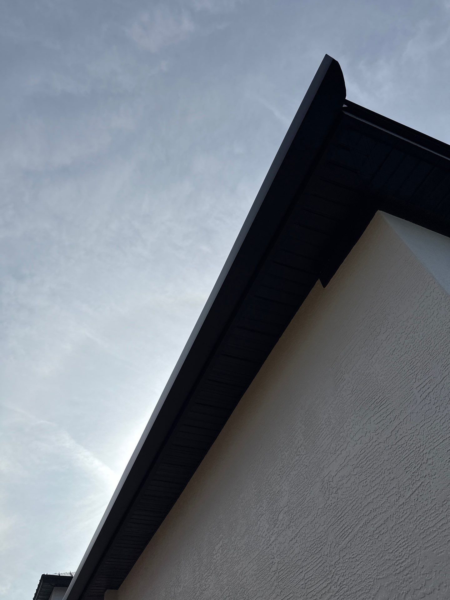 Soffit and Fascia Installation and black seamless gutters in Sarasota FL by Gutter Professors