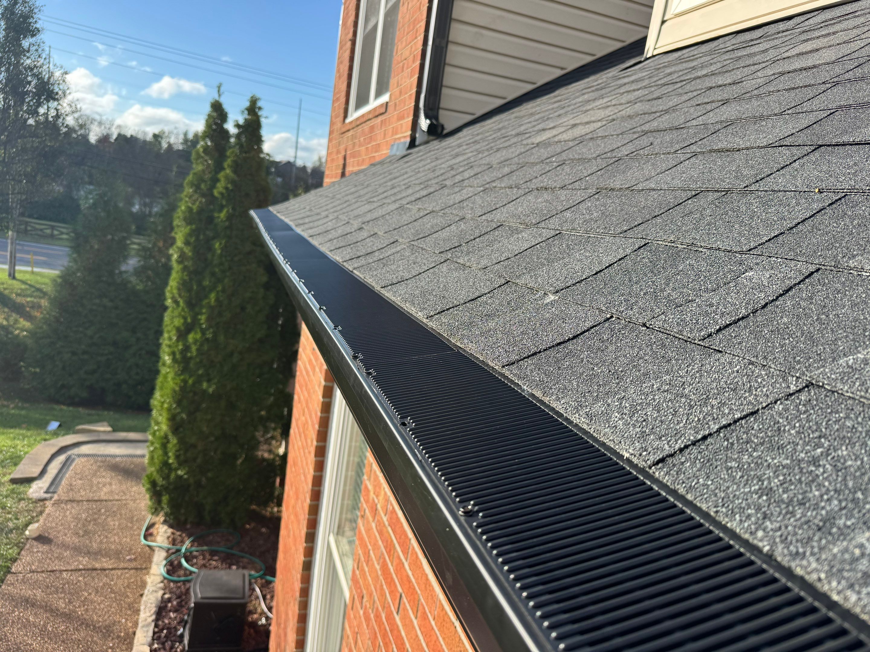 Charcoal Black Re-Roof & Gutters by Royal House LLC