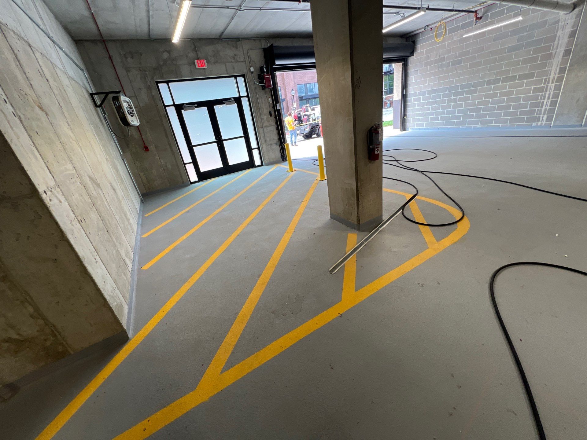 Parking garage using Hot water by Northern Power Washing LLC.