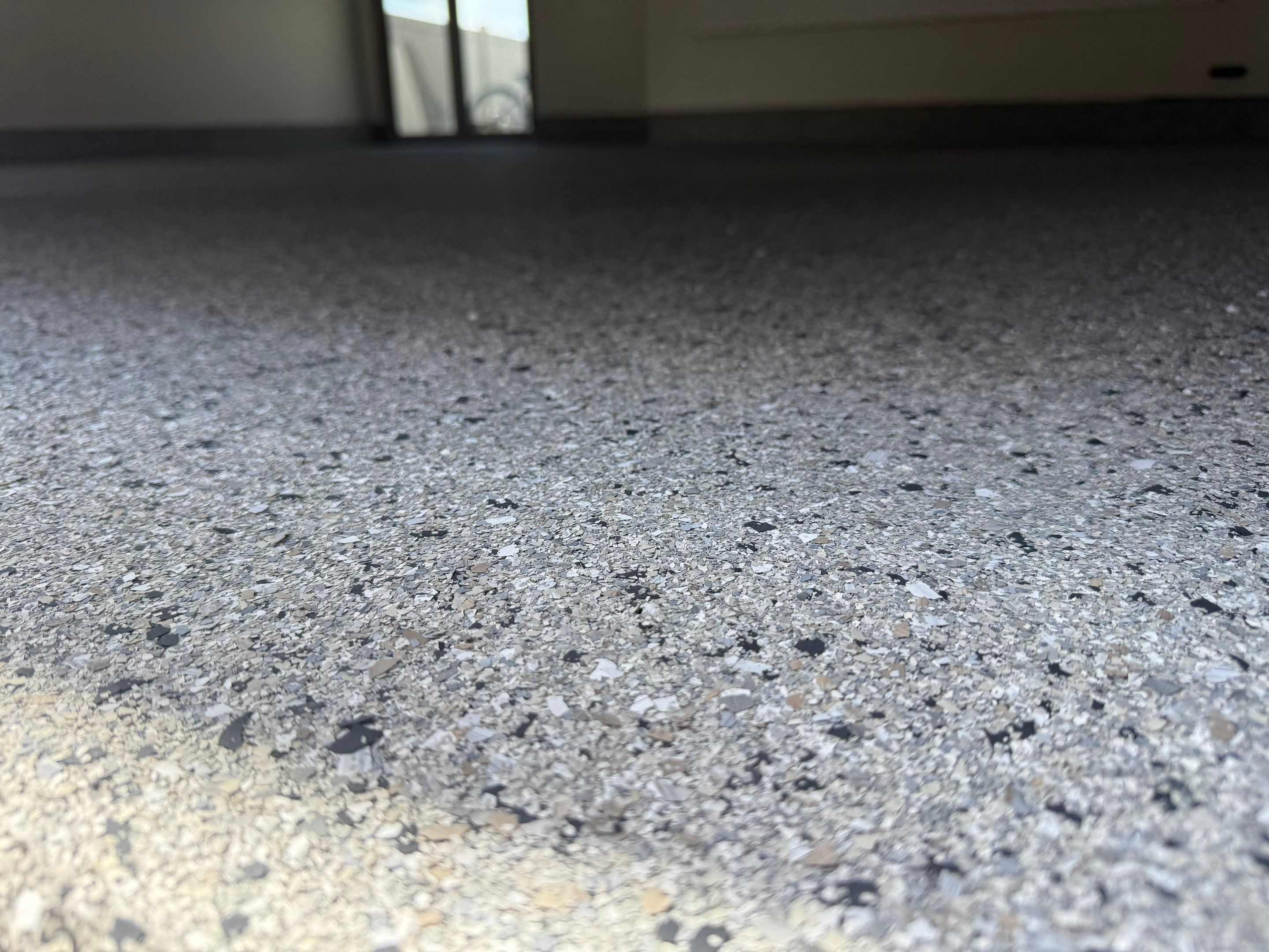 Residential Garage Floor Coating with Grey Speckled Epoxy Finish by Select Painting, Coatings & Garage Cabinets