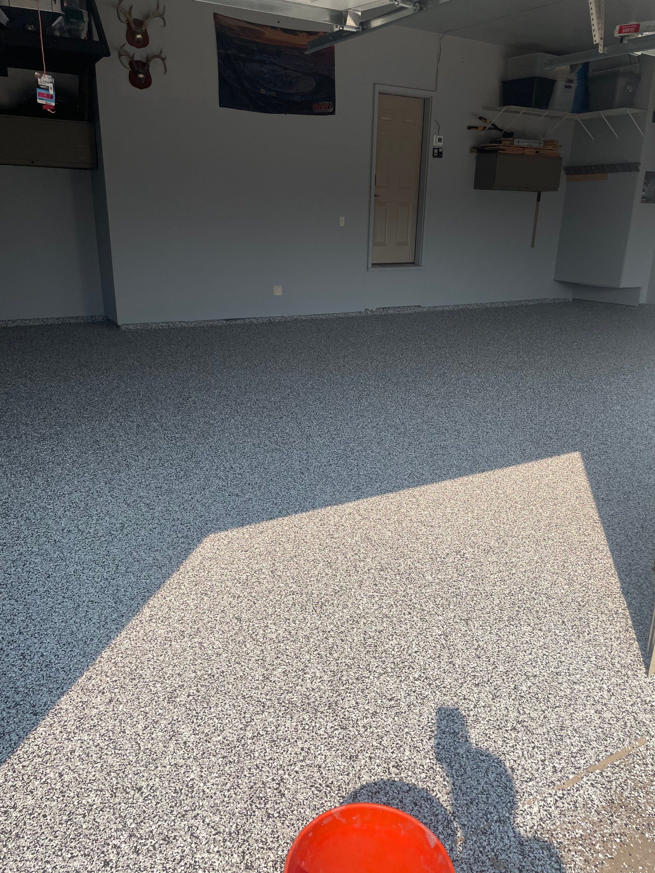 Sioux Falls Garage Concrete Coating Installation with Domino Flake by Select Painting, Coatings & Garage Cabinets