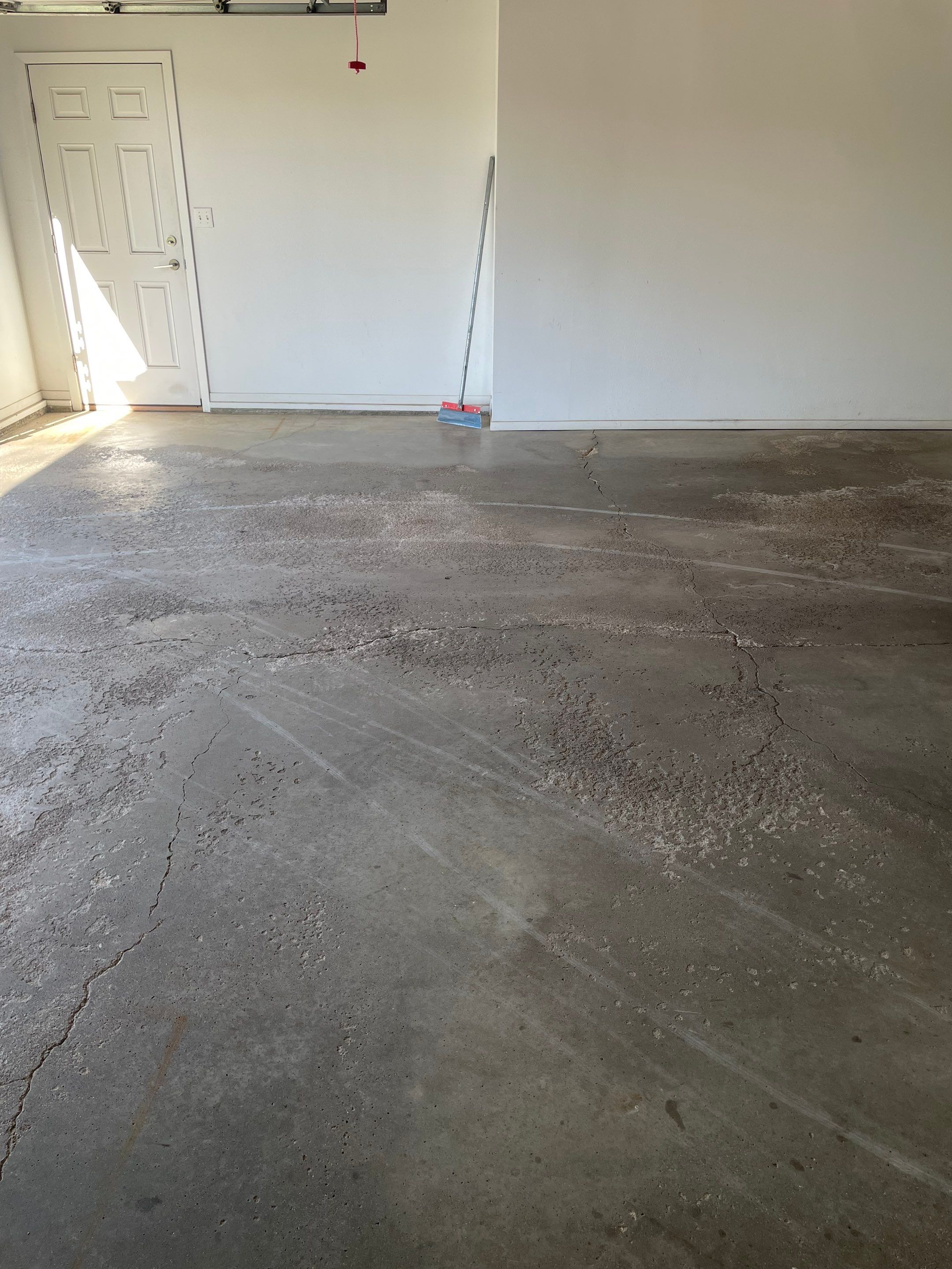 Yankton Garage Floor Restoration with Gray Speckled Epoxy Coating by Select Painting, Coatings & Garage Cabinets