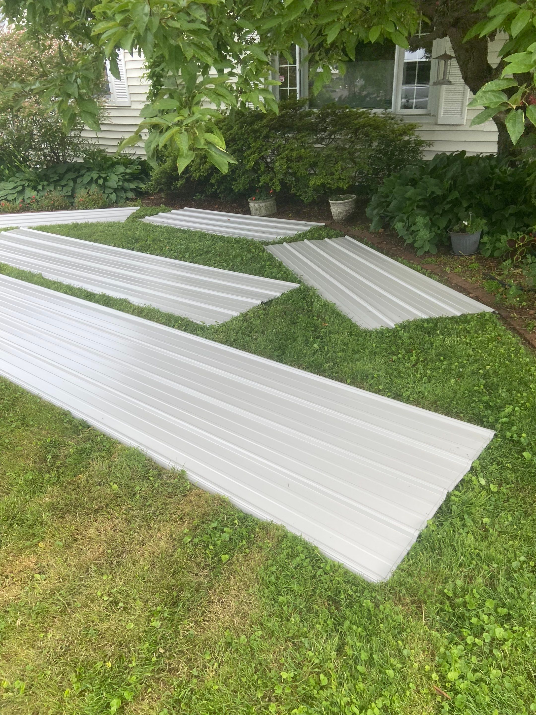 Metal Roofing, Skylights, Porch Build by Secure Construction Company Inc