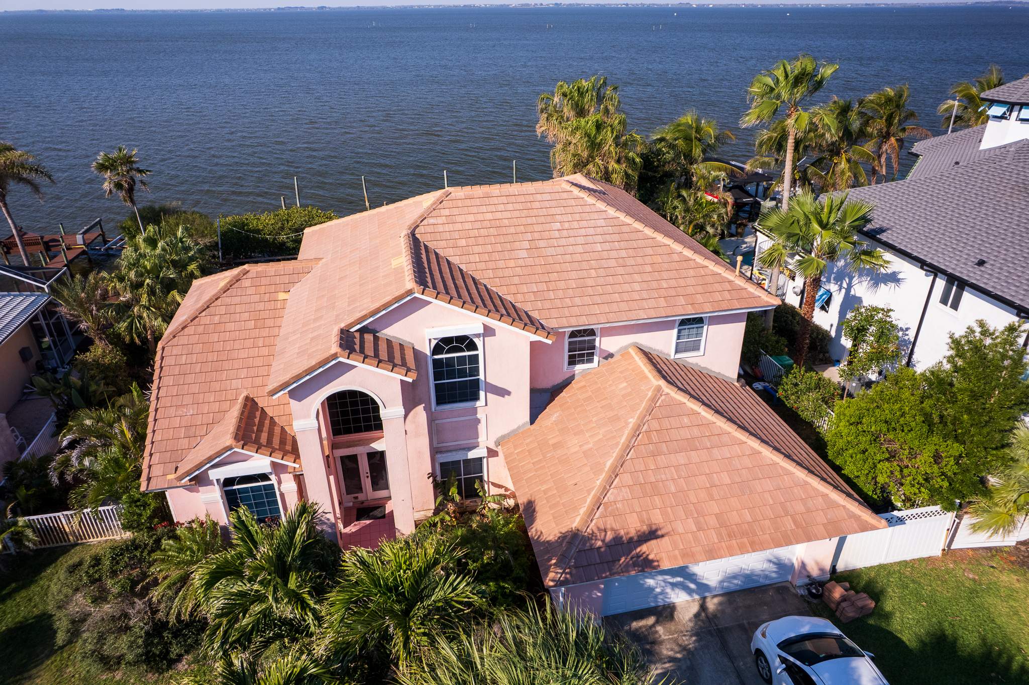 Full Clay Tile Roof Replacement and Deck Repair in Cocoa Beach, Florida by Wiedmann Construction & Roofing