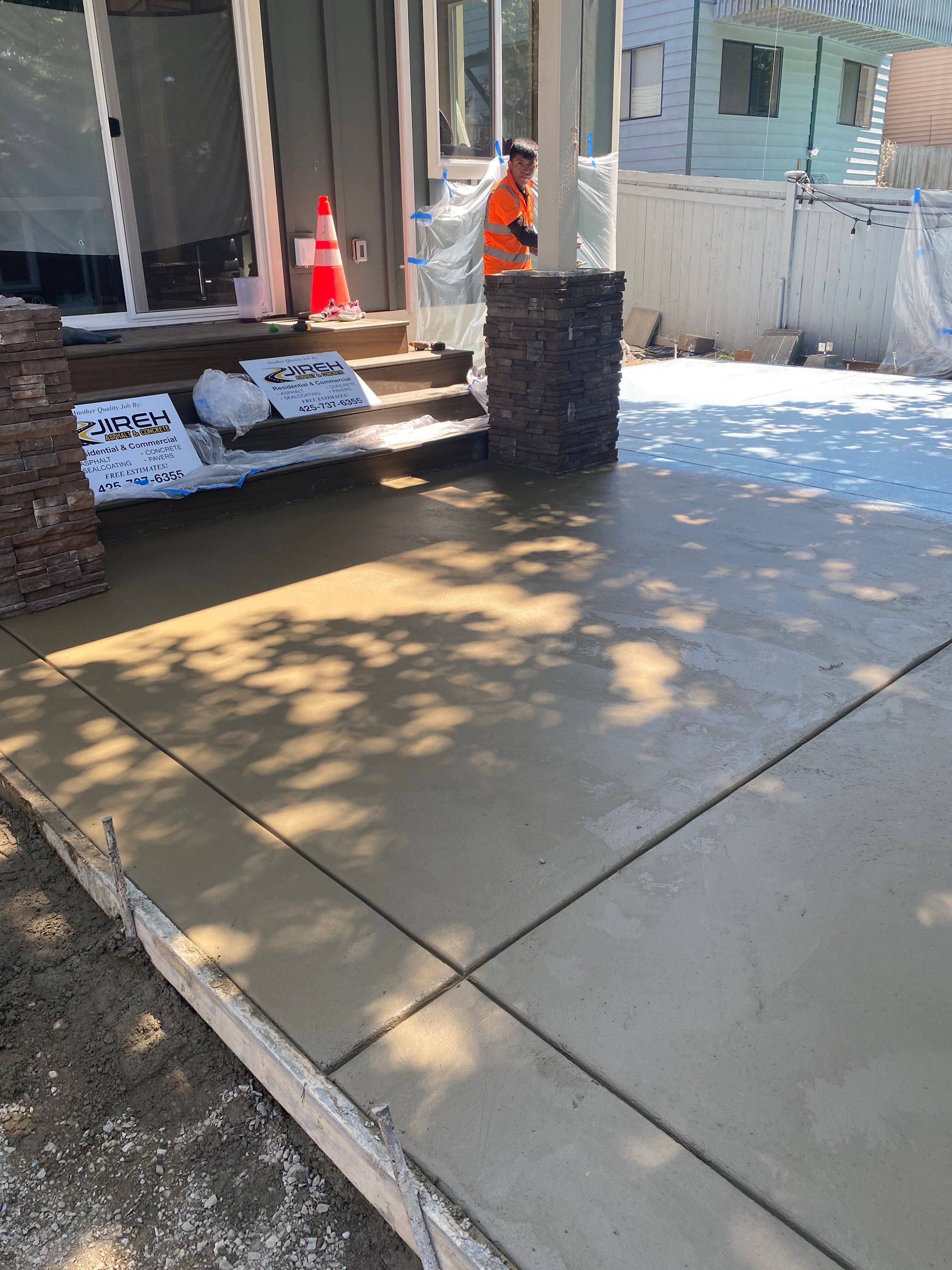 Patio Installation using Concrete, Retaining walls, and Turf install by Jireh Asphalt & Concrete Inc 