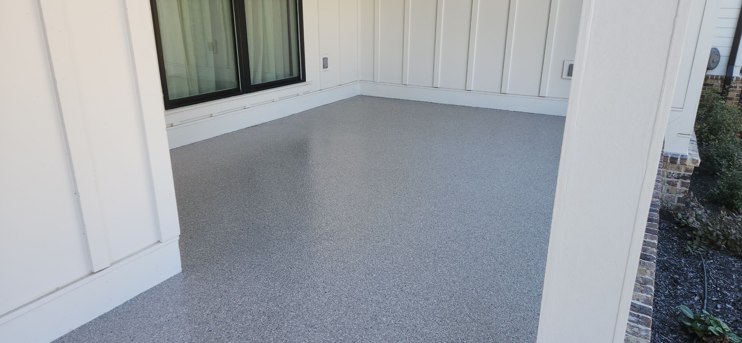Front Porch and Garage using Coyote & Pumice by Elite Floor Solutions