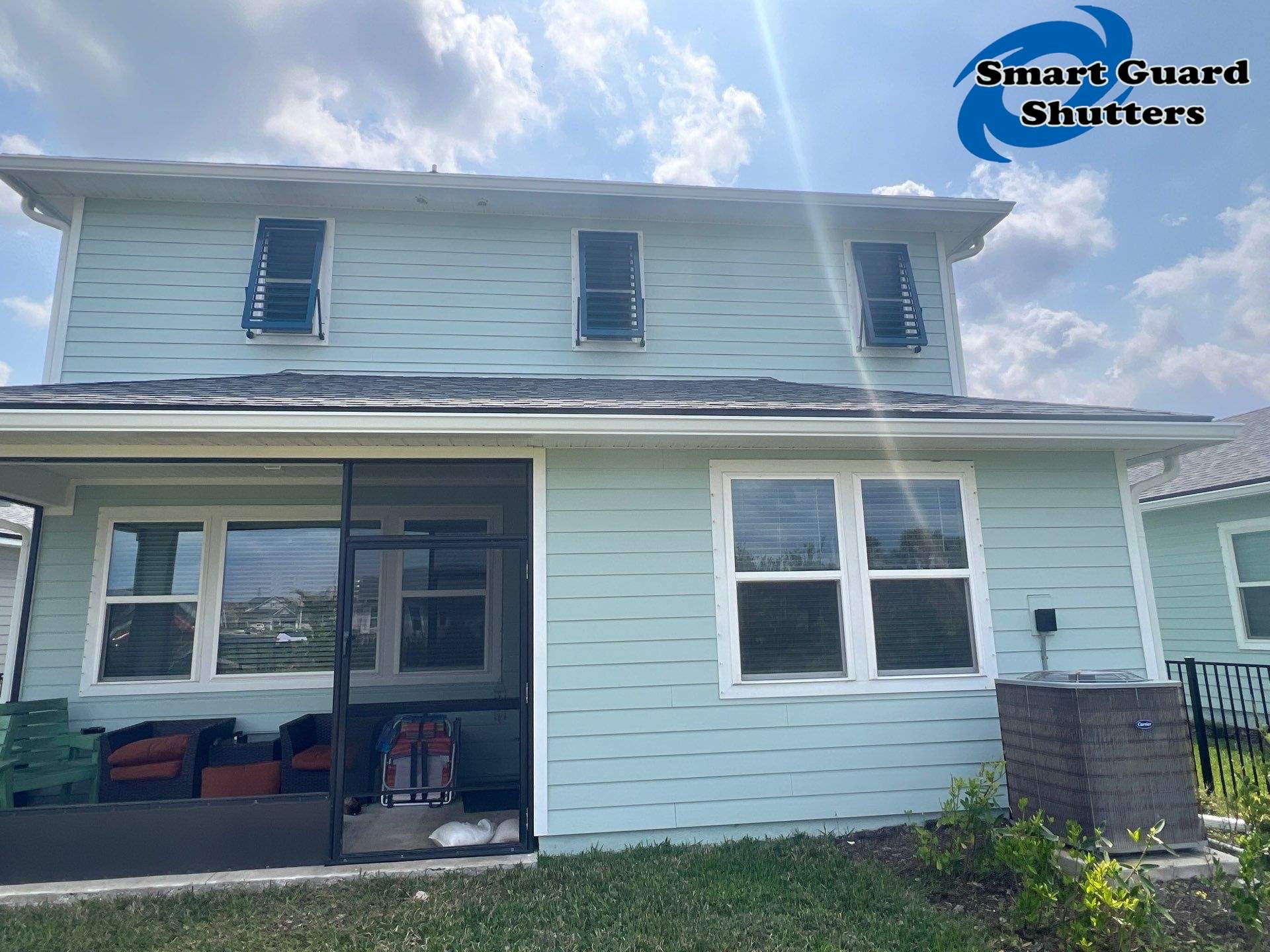 Impact Bahamas in Ocean Blue, Accordion in White by Smart Guard Shutters