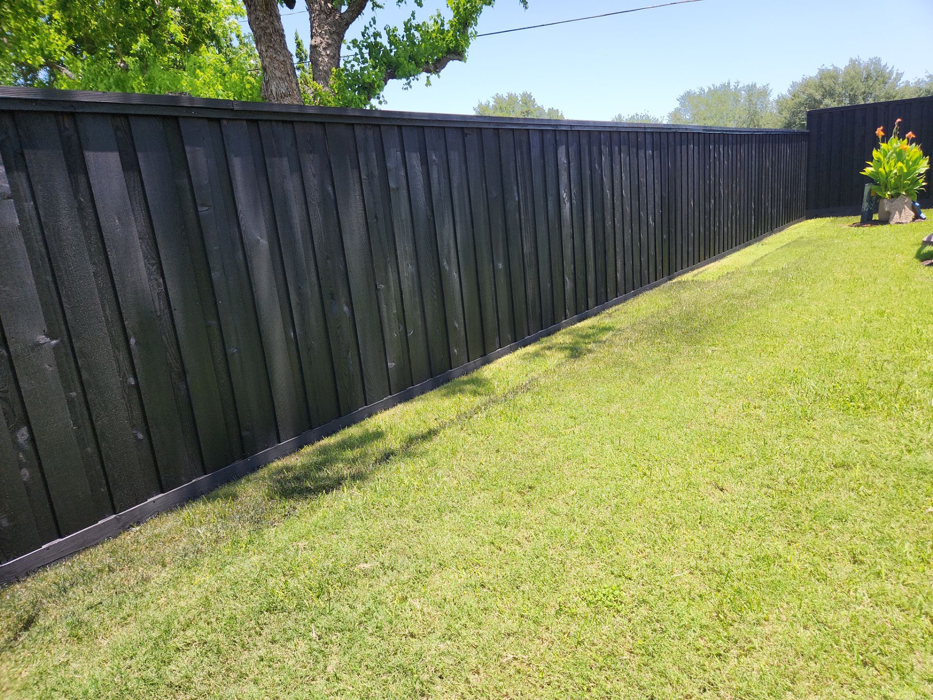 Modern Black Fence Finish by Tim's Fences