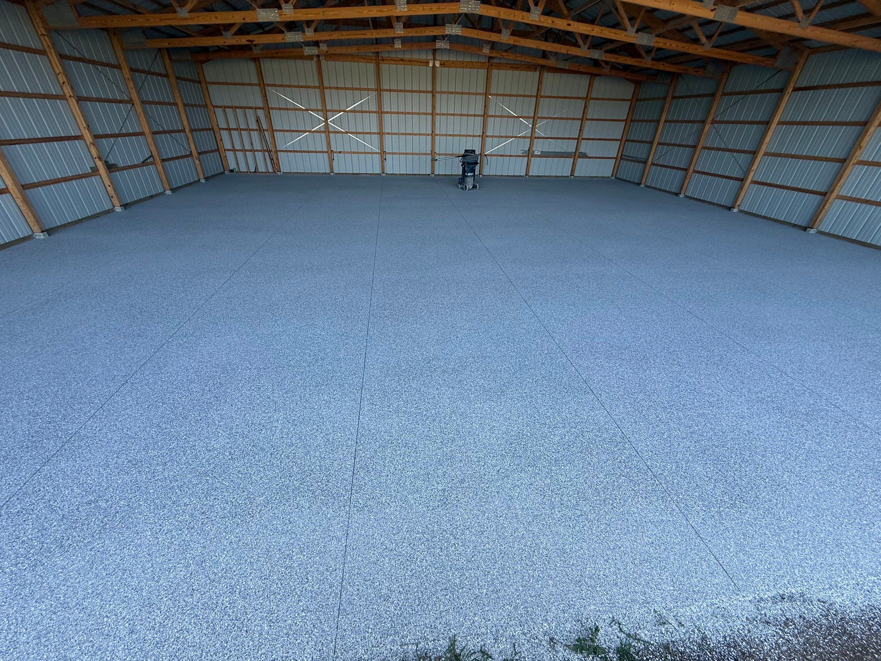 Durable Grey Speckled Epoxy Floor Coating for Yankton Shop by Select Painting, Coatings & Garage Cabinets