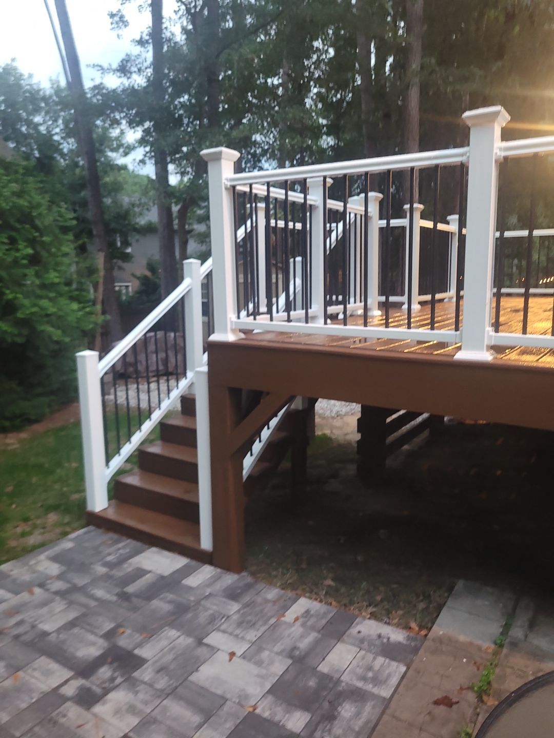 Fuquay-Varina Outdoor Upgrade – Composite Deck & Paved Landing by Elite Remodeling and Design LLC