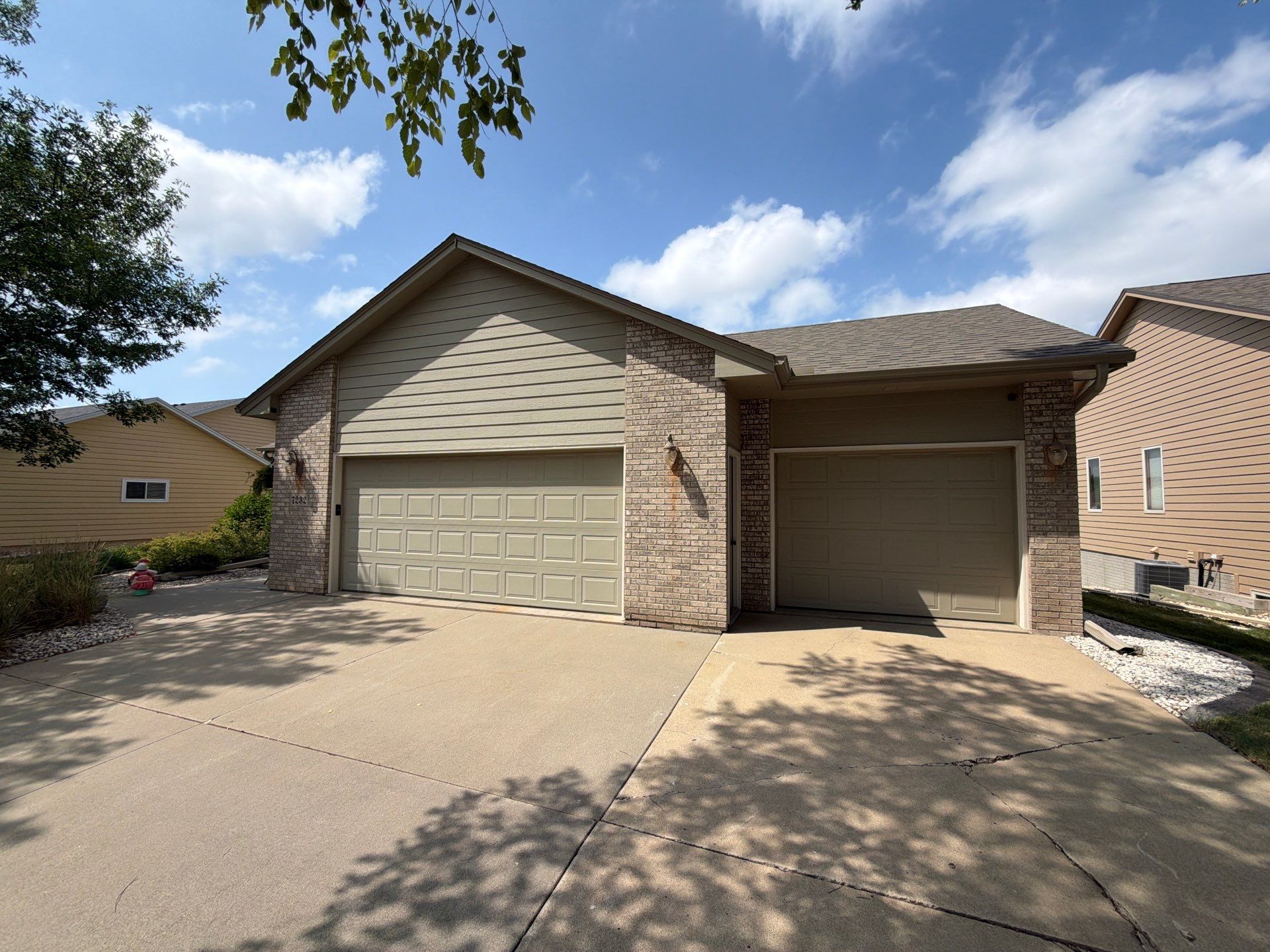 Residential Exterior Painting and Siding Refresh in Sioux Falls by Select Painting, Coatings & Garage Cabinets