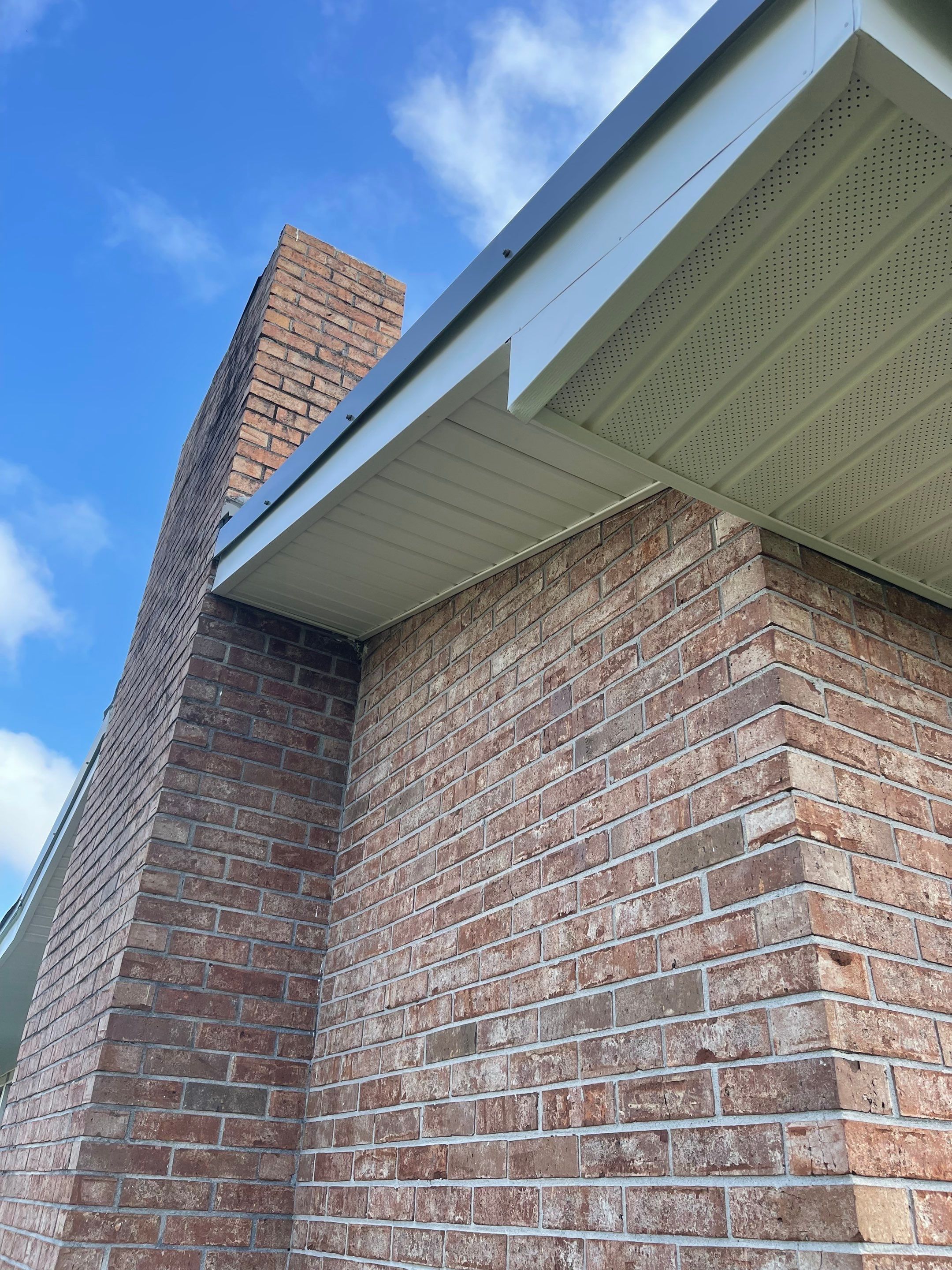 Soffit and Fascia Installation Using White Vinyl Soffit by Gutter Professors