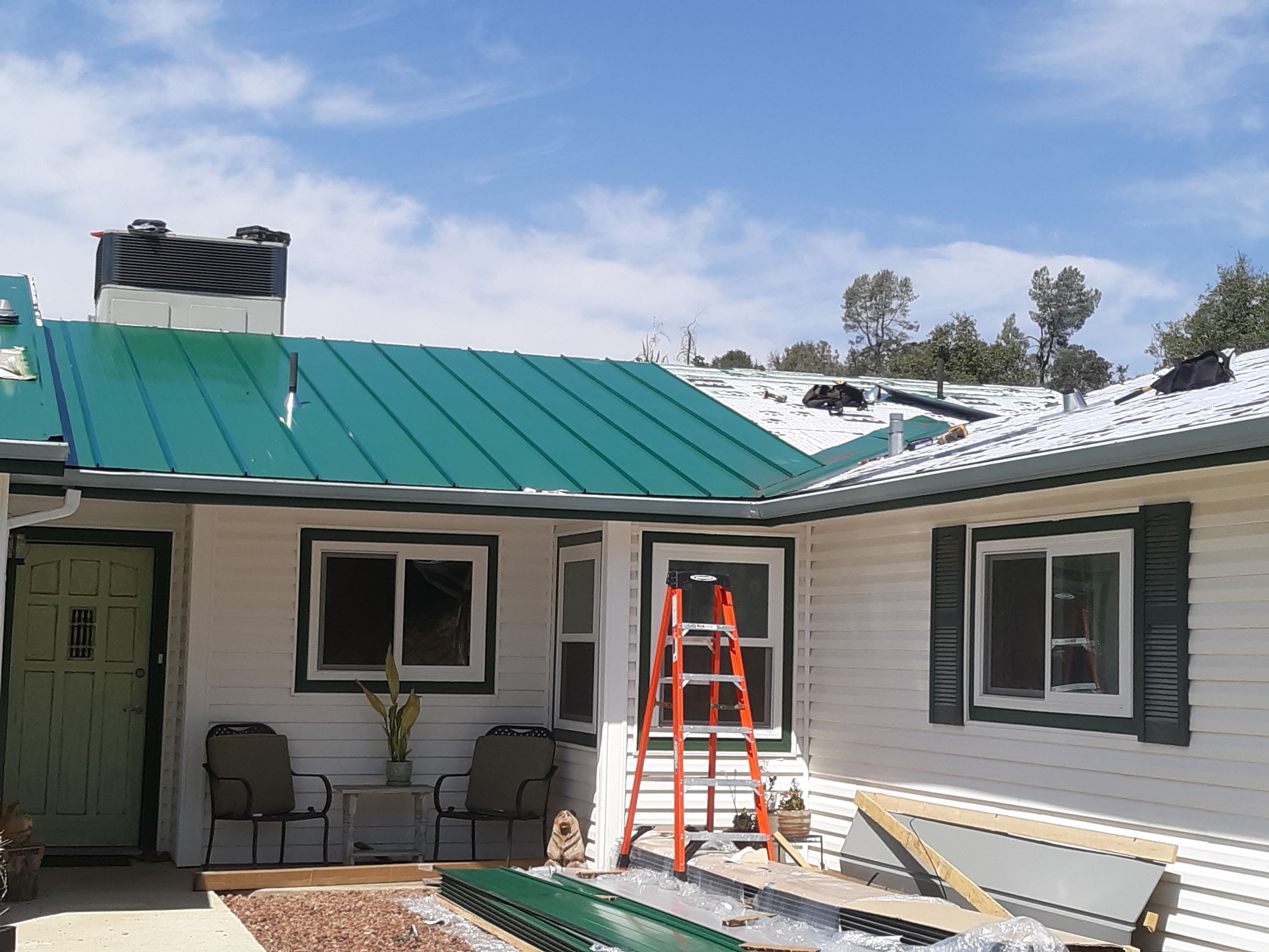 Metal roofing installation using Standing seam metal roofing system by Straight Edge Roofing Inc