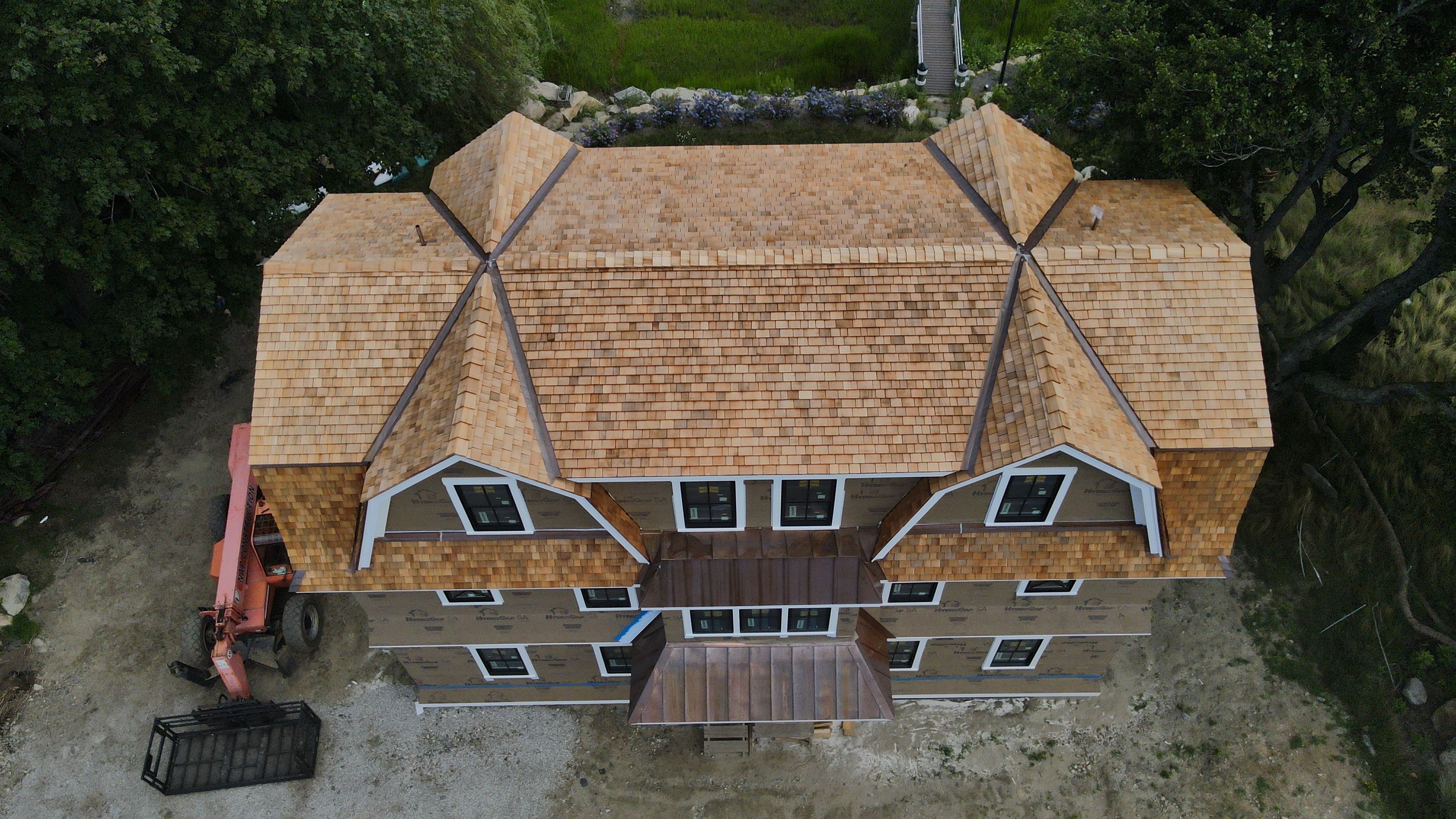 Great Island - Red Cedar Roofing, Yellow Cedar Siding, Standing Seam Copper, & Copper Gutters  by Rinaldi Brothers