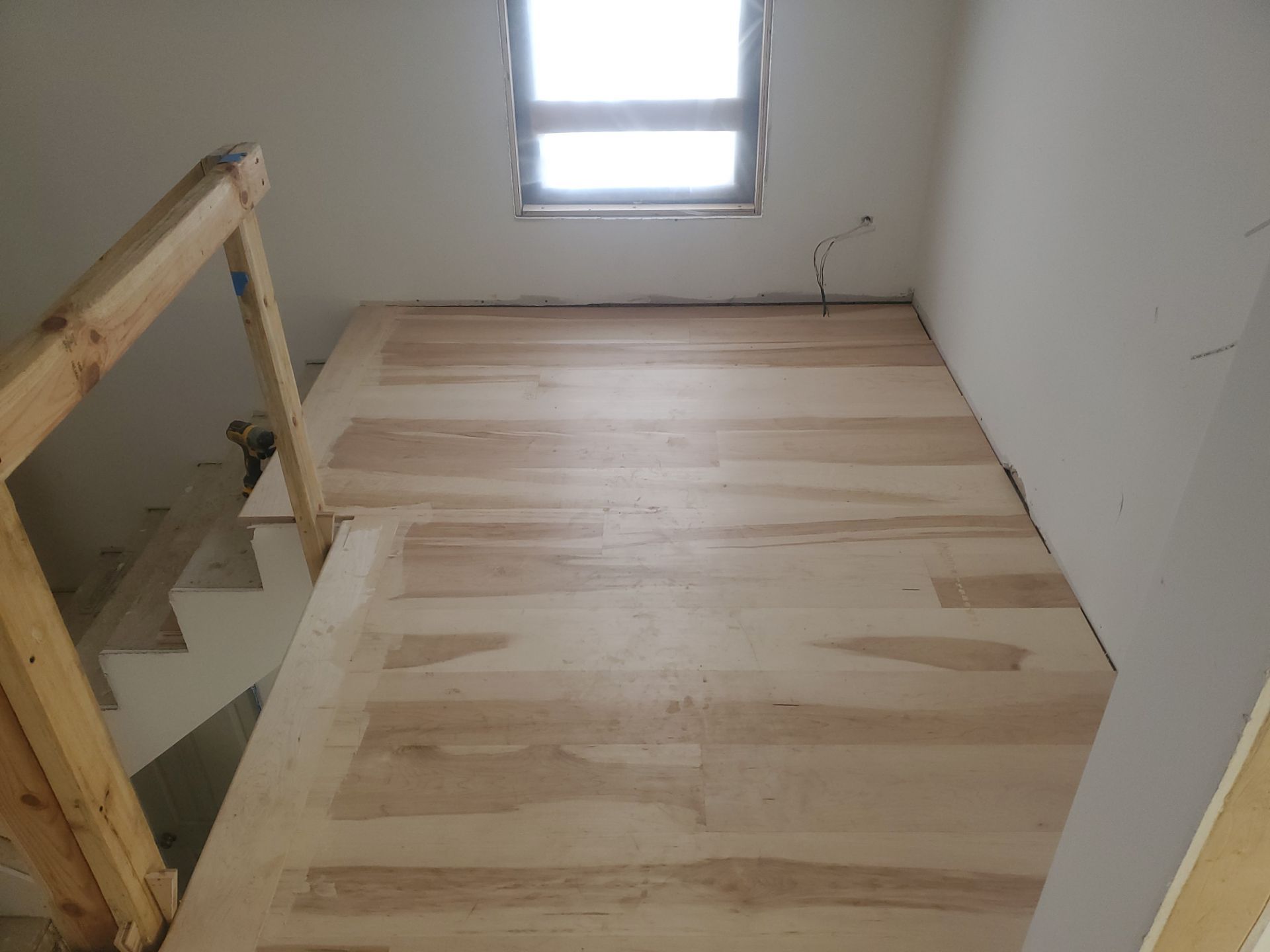 Full glue down Installation over radiant heat 7" Maple character grade by Ann Arbor Hardwoods 