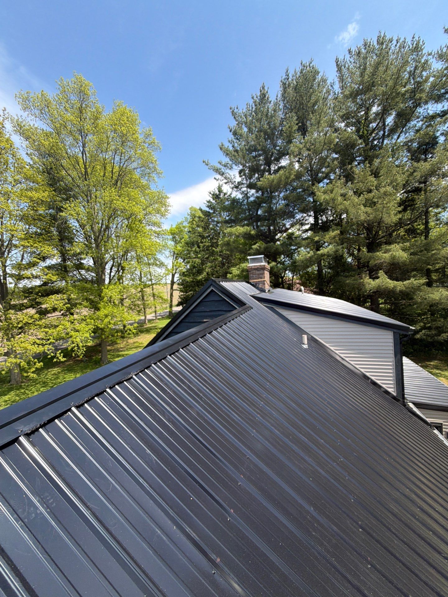 Classic Rib Metal Roofing - Shiny Black by Hoel Roofing & Remodeling