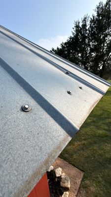 Edge view of a newly installed metal roof.