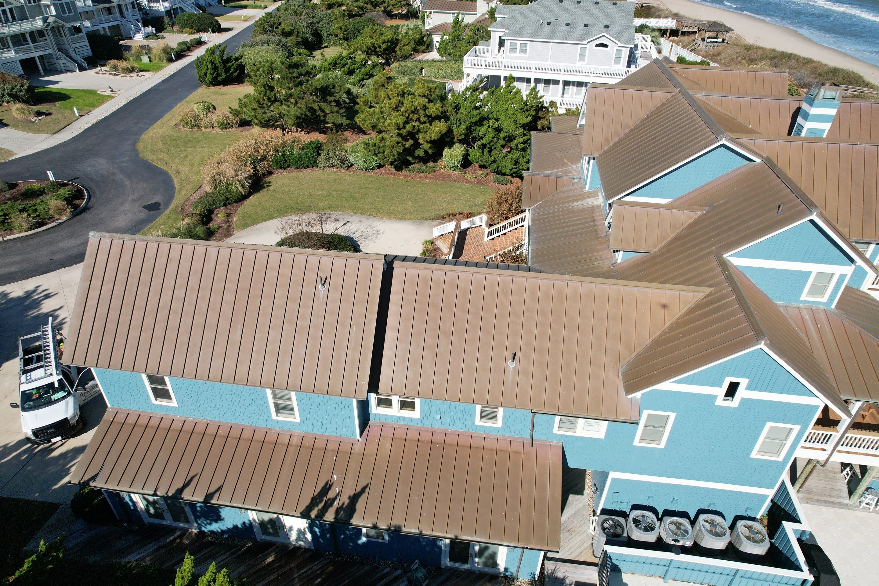 Large Metal Roof Transformation by Gallop Roofing & Remodeling, Inc.