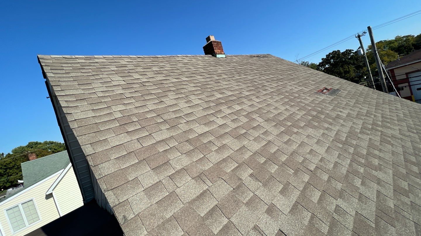 Onyx Black Shingles by Reimagine Roofing