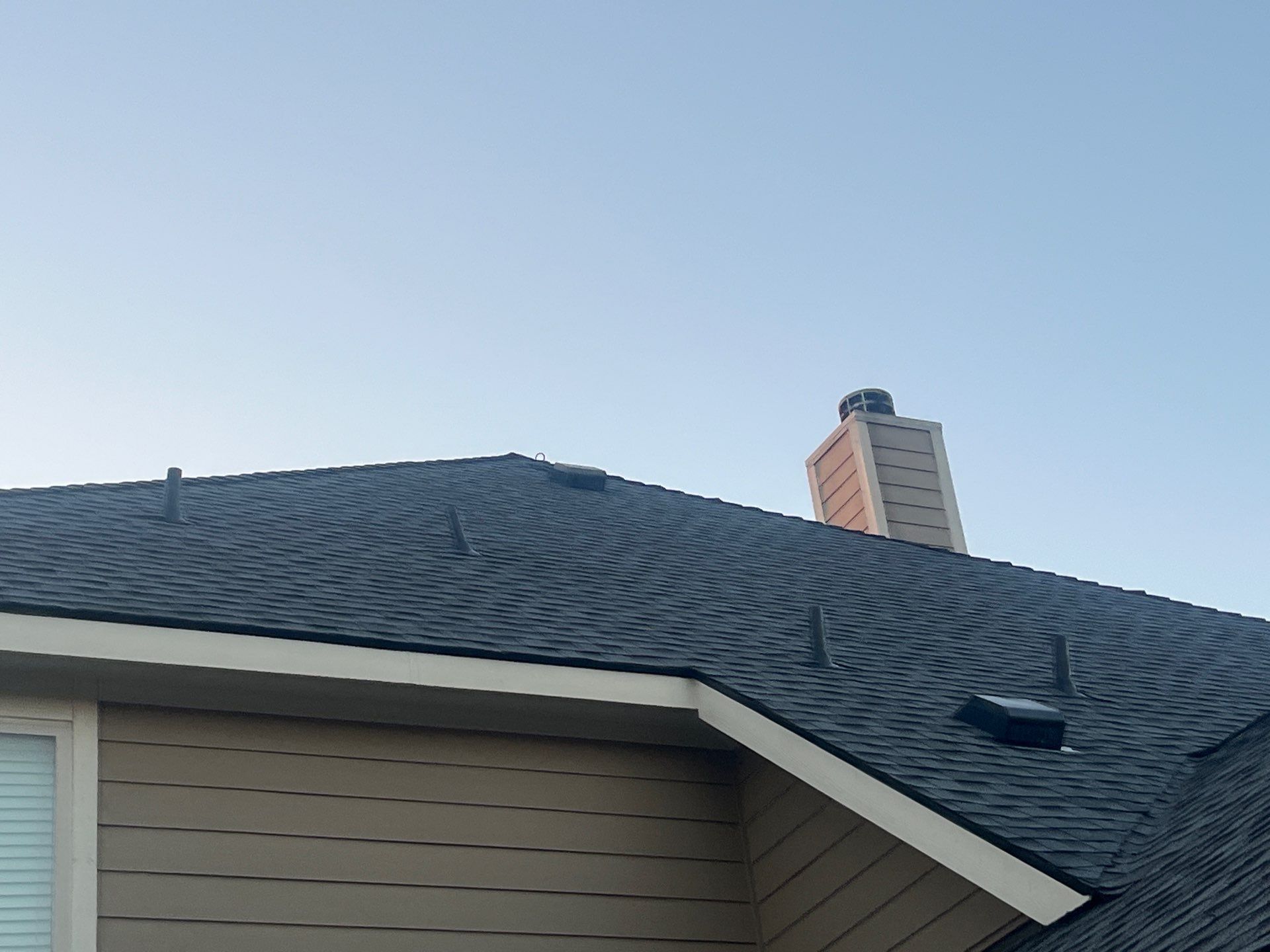 Medium brown brick with GAF Pewter Gray  by Tejas Roofworks + Restoration