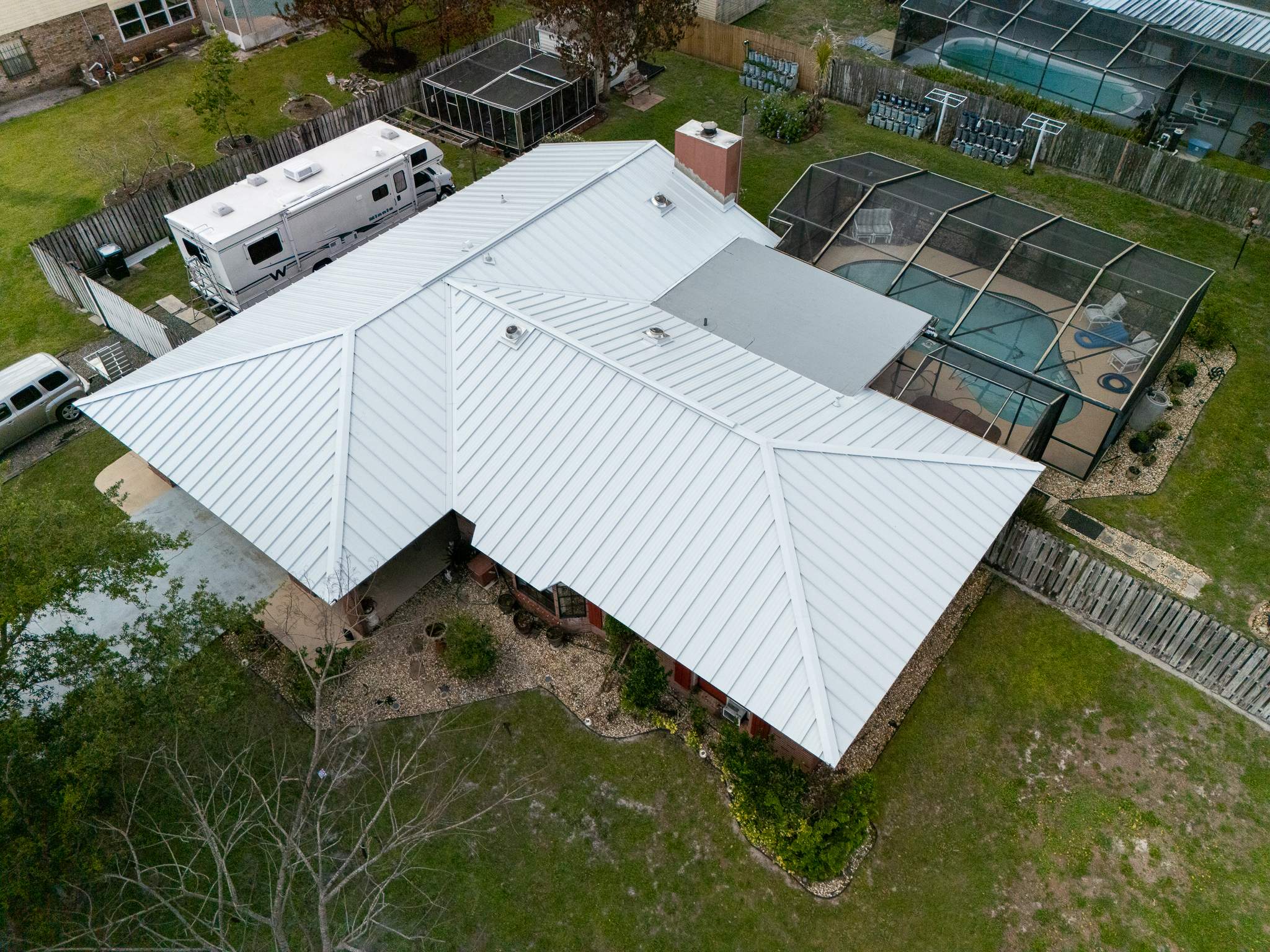 White Standing Seam Metal Roof Replacement and Hurricane Reinforcement in Palm Bay, Florida by Wiedmann Construction & Roofing
