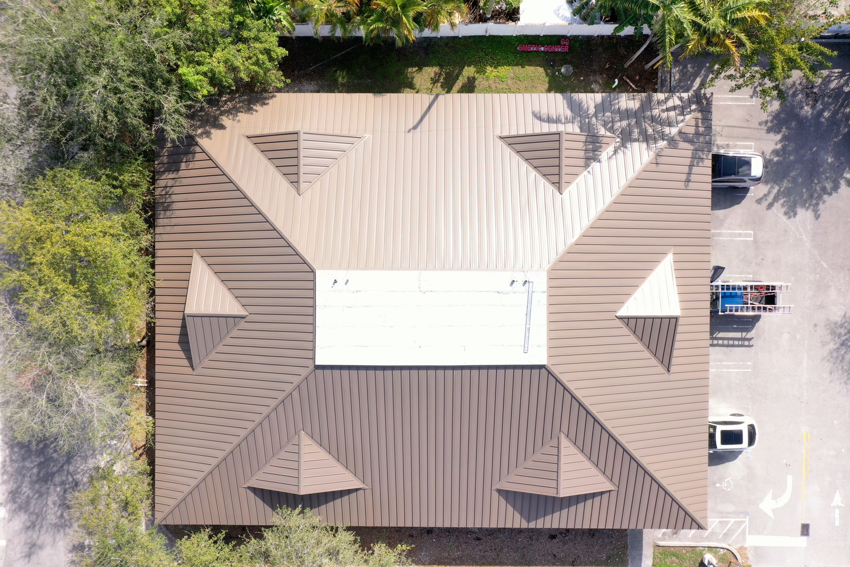 COMMERCIAL REROOF 24 GUAGE MEDIUM BRONZE 1-1/2" MECHANICAL SEAM "ZEBRA METHOD" by Earl W. Johnston Roofing 