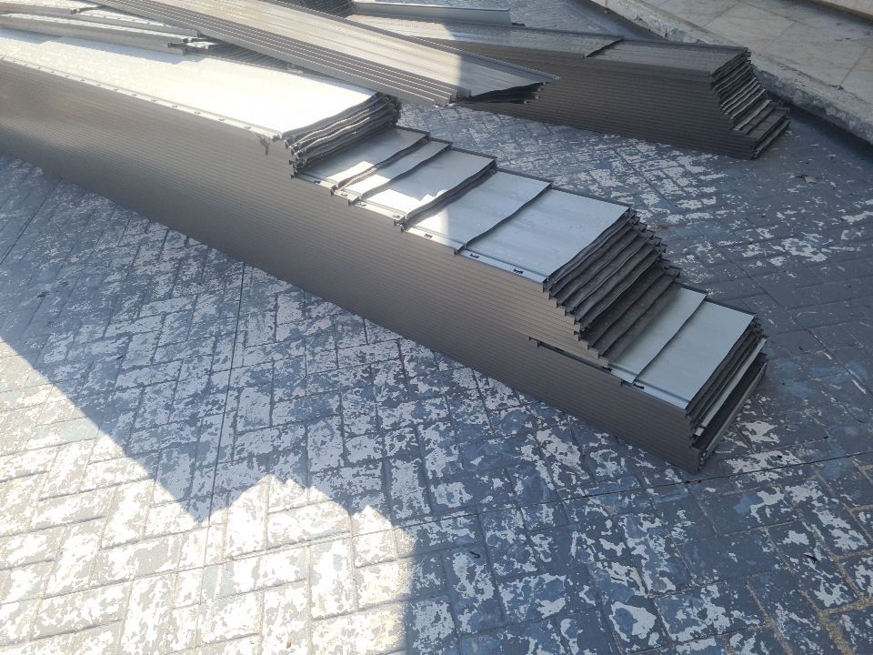 Residential Roofing Installation using 1" Nail strip metal roof by BLUES BROTHERS CONSTRUCTION CORP