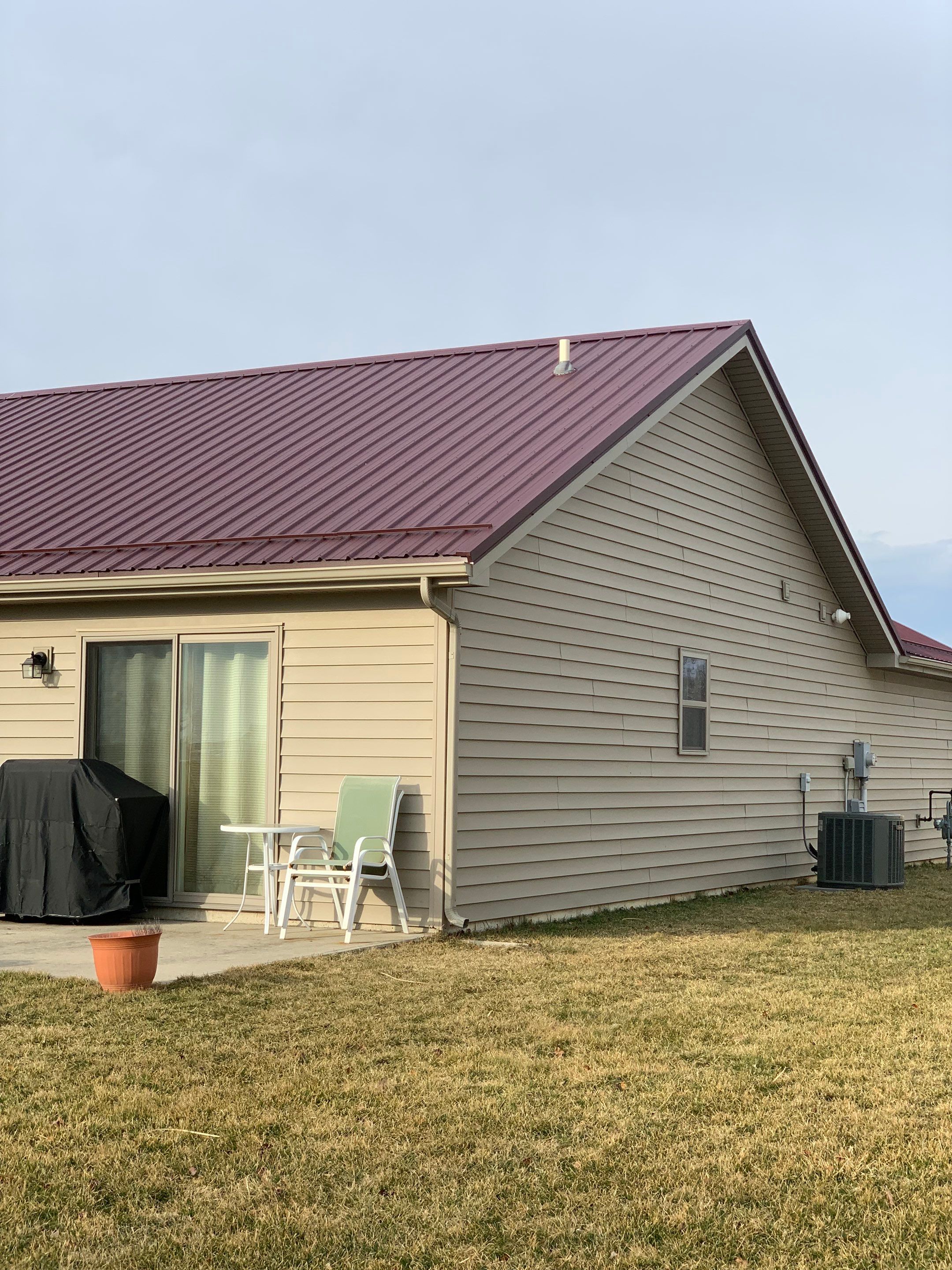 Burgundy Exposed Fastener Metal Roof in Columbia City, Indiana Country Home by 4Ever Metal Roofing