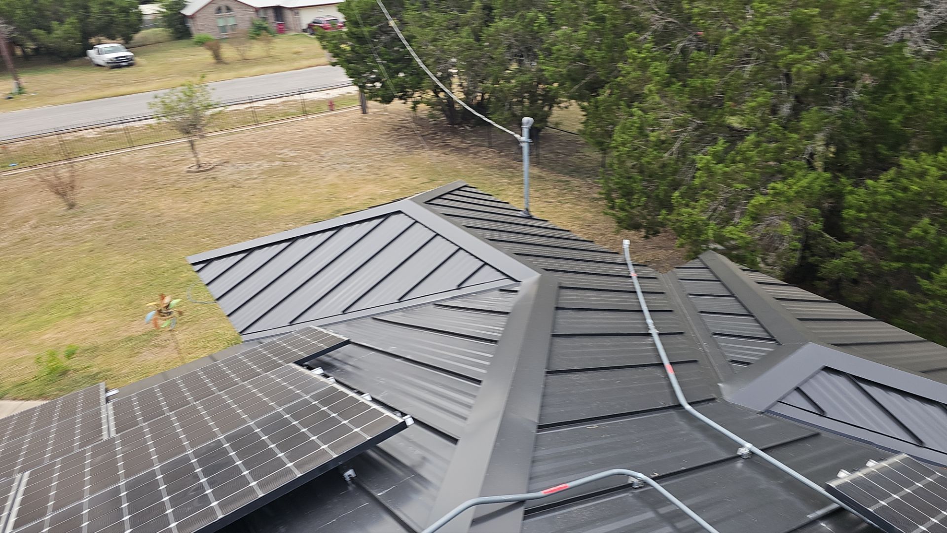 Residential Roof Replacement using 24 GA Double-Lock - Matte Black by Action Exteriors Austin
