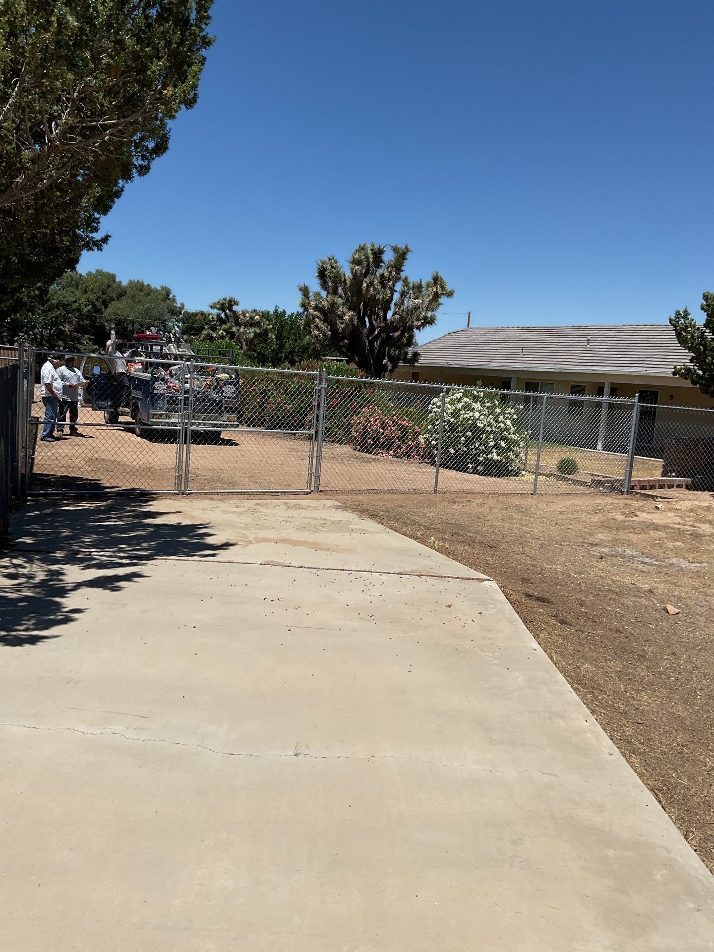 Chain link gate installation using chain -link by Fence Guys Inc. 