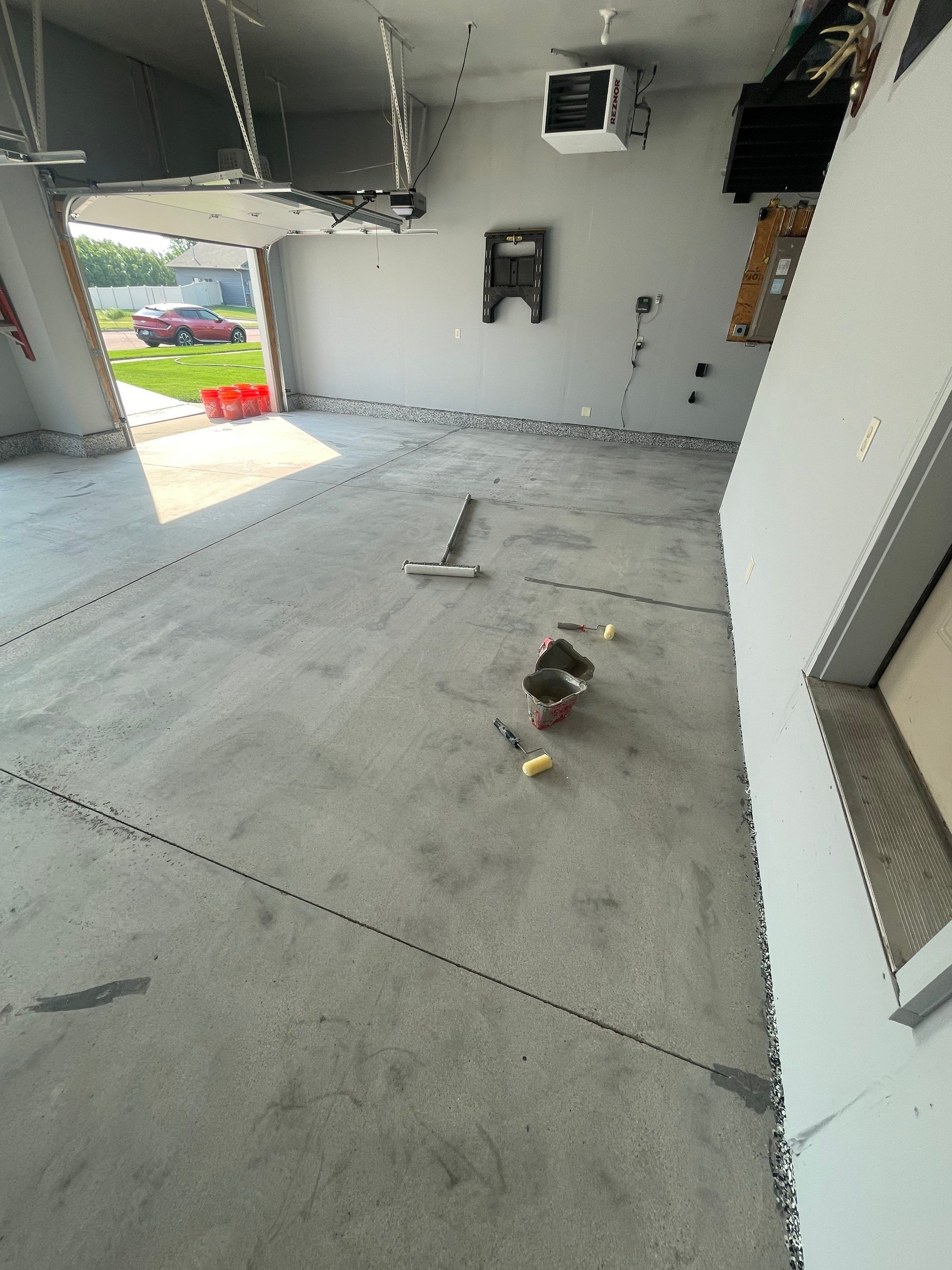 Sioux Falls Garage Concrete Coating Installation with Domino Flake by Select Painting, Coatings & Garage Cabinets