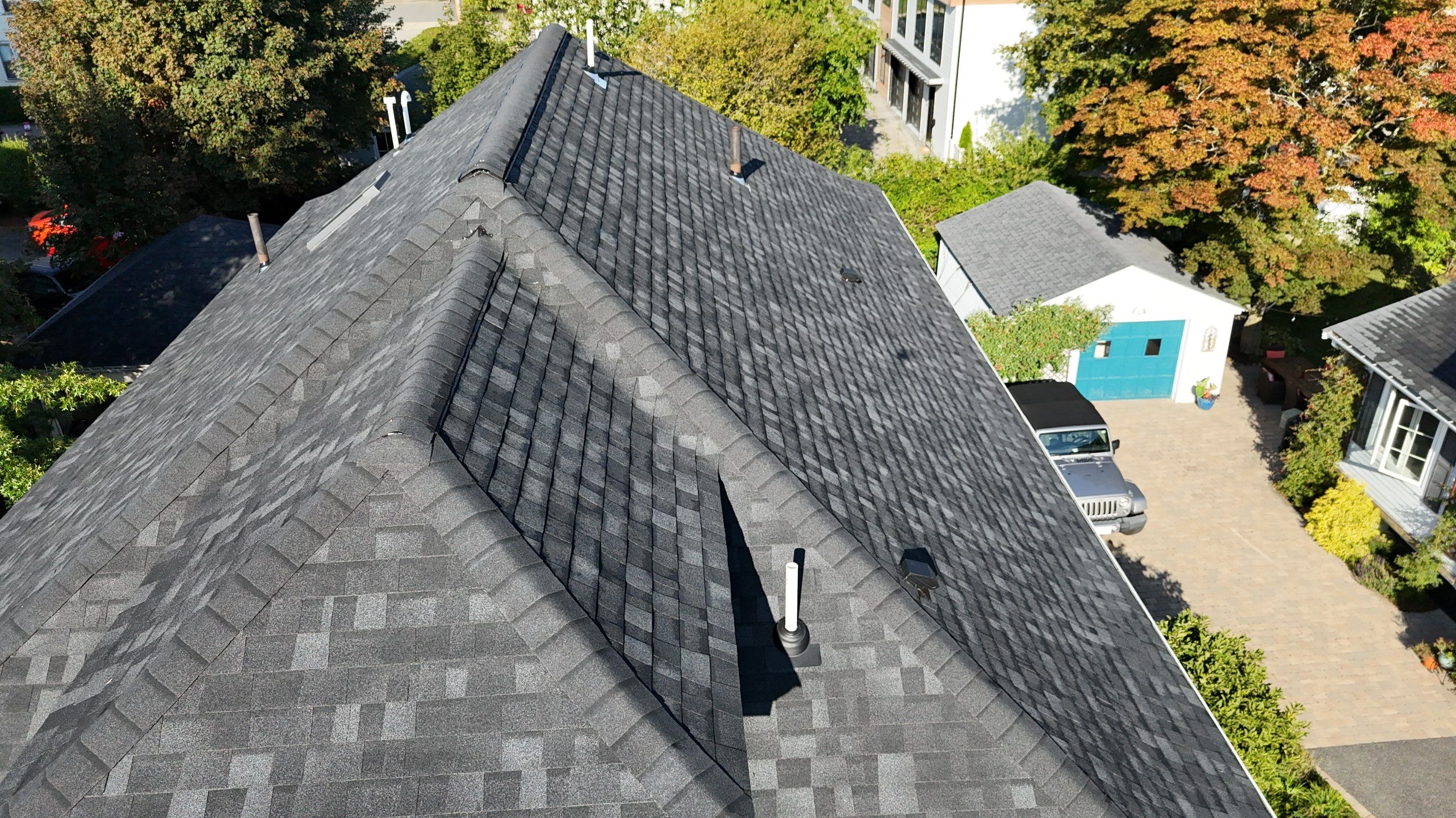 Roof Replacement with Skylight Flashing in Waltham, MA by Mighty Dog Roofing of Greater Middlesex County