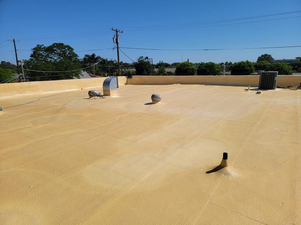 Spray foam and coatings using Conklin Benchmark/PUMA XL coatings and spray foam by Straight Edge Roofing Inc