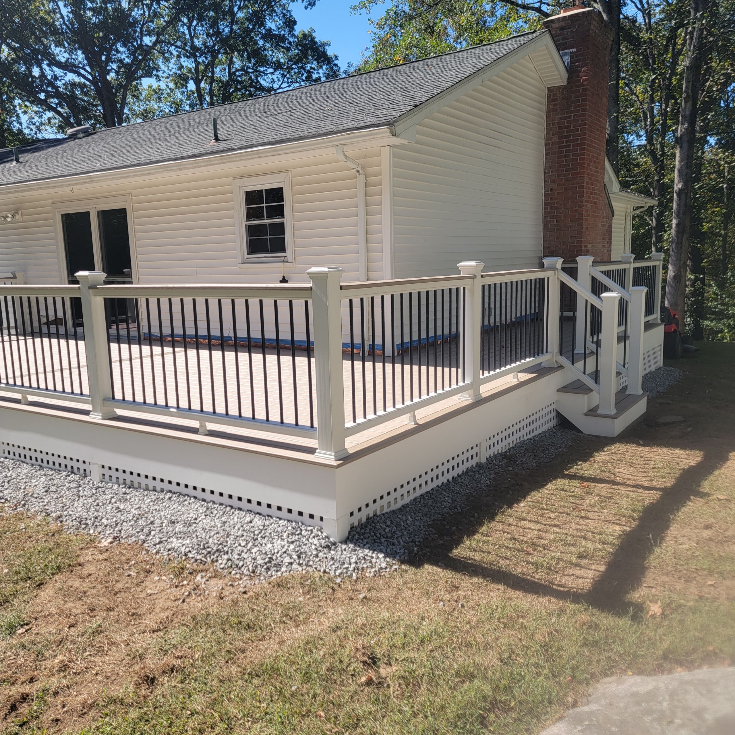 Deck replacement using Trex Transcend Rope swing and Transcend cocktail rail and trex lattice  by DiGiorgi Roofing and Siding Inc