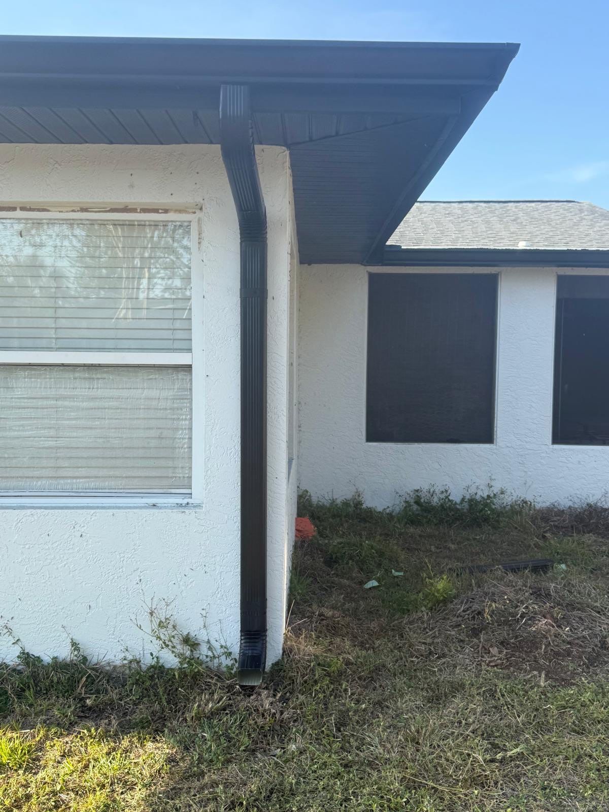New Downspouts and Splash Guards in Sarasota FL by Gutter Professors