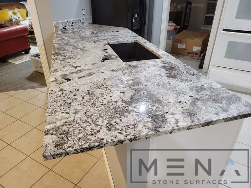 Kitchen countertops using White Normandy Granite by Mena stone surfaces